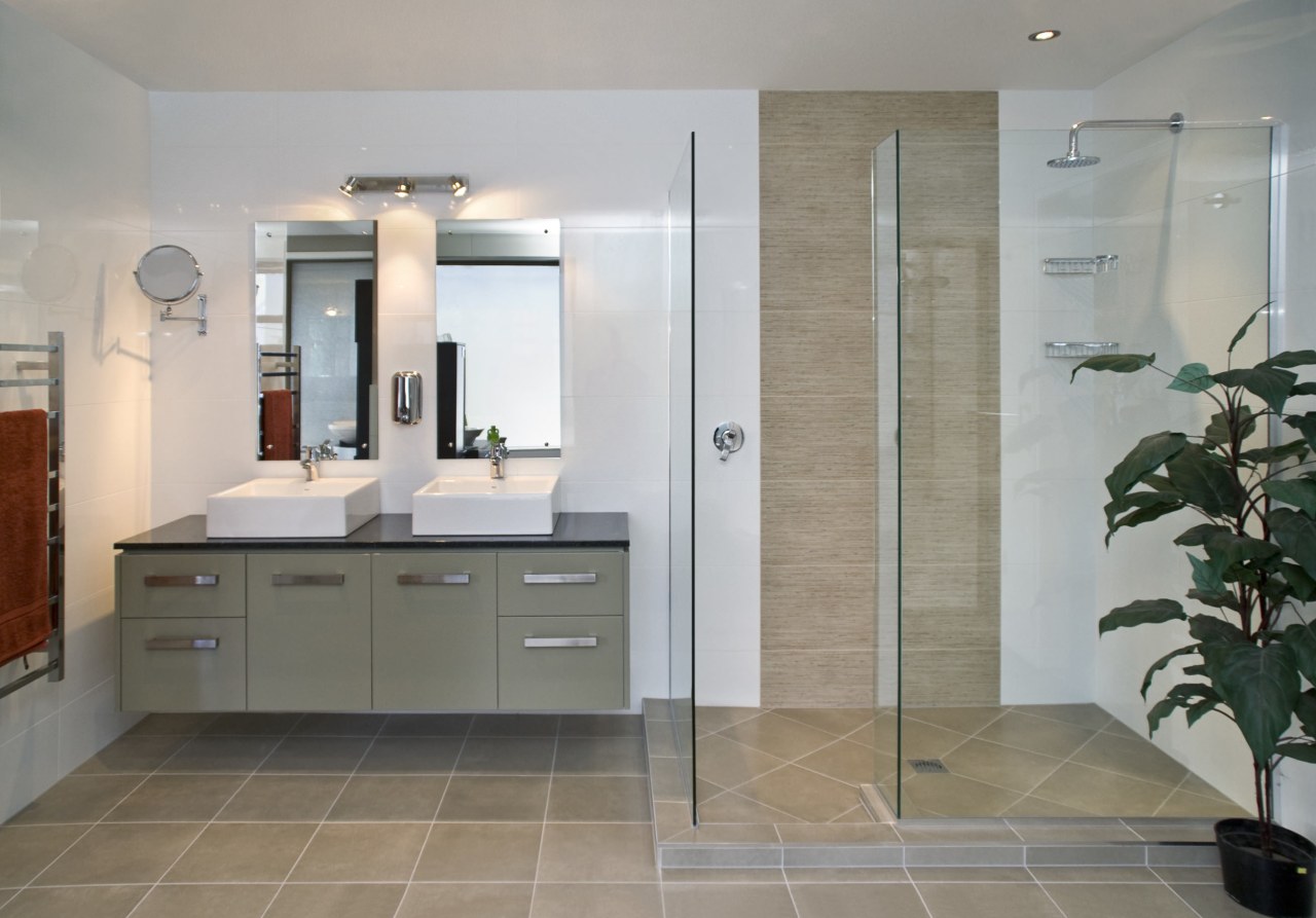 Image of one of the bathroom showrooms at bathroom, bathroom accessory, bathroom cabinet, cabinetry, countertop, floor, flooring, interior design, kitchen, room, tile, wall, gray