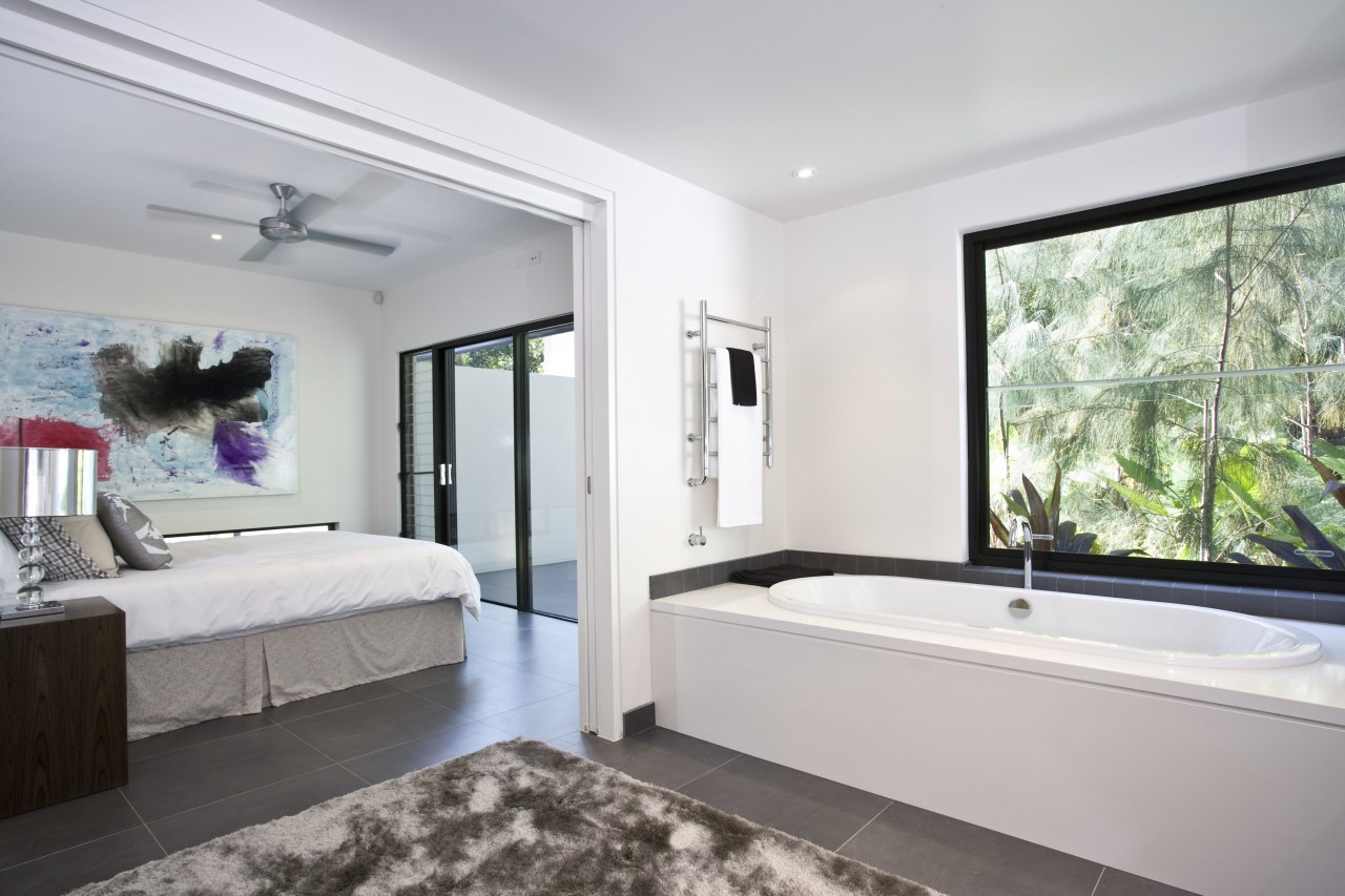 The downstairs bath enjoys an intimate view of bedroom, ceiling, estate, interior design, property, real estate, room, window, gray