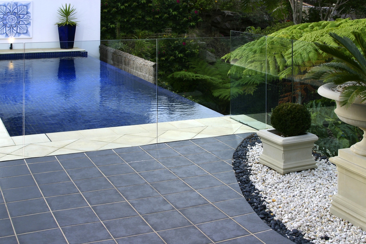 A Stain-proof sealer has been applied to the backyard, floor, flooring, landscaping, reflecting pool, swimming pool, walkway, water, water feature