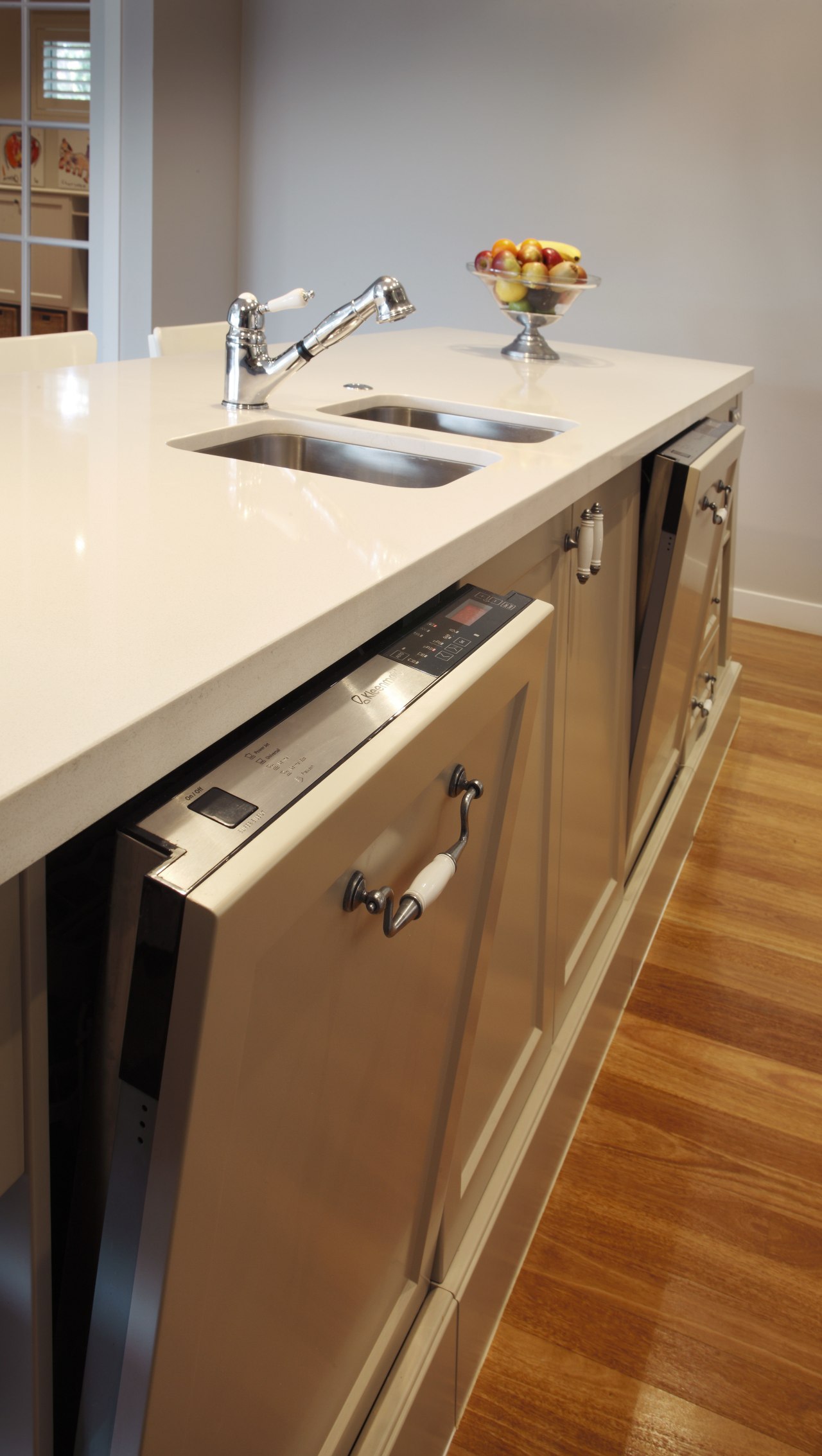 Dual intergrated dishwashers mean all dishses, plates, glasses cabinetry, countertop, drawer, floor, flooring, furniture, hardwood, kitchen, room, sink, table, wood, wood stain, brown