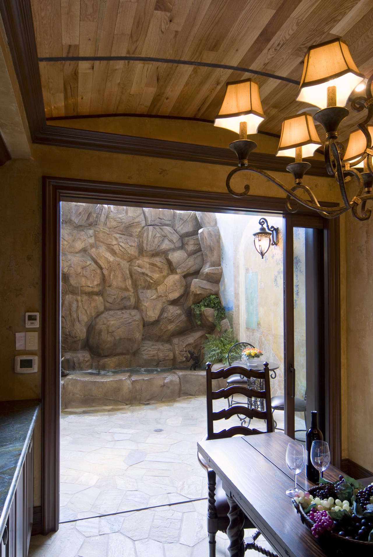 Another large lift-and-slide pocket door opens up the beam, ceiling, estate, home, house, interior design, real estate, room, wall, window, brown