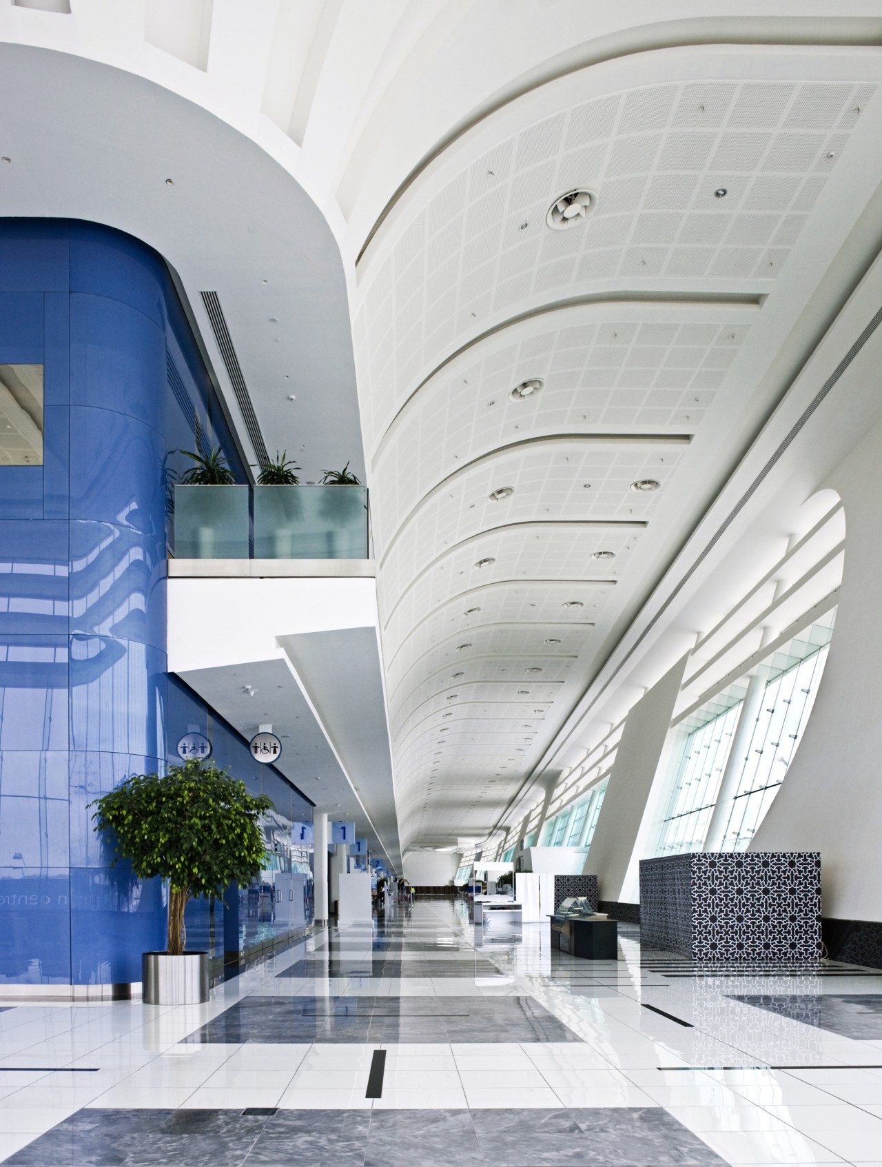 The expansive concourse has been designed as an architecture, building, ceiling, daylighting, glass, headquarters, lobby, structure, white, gray