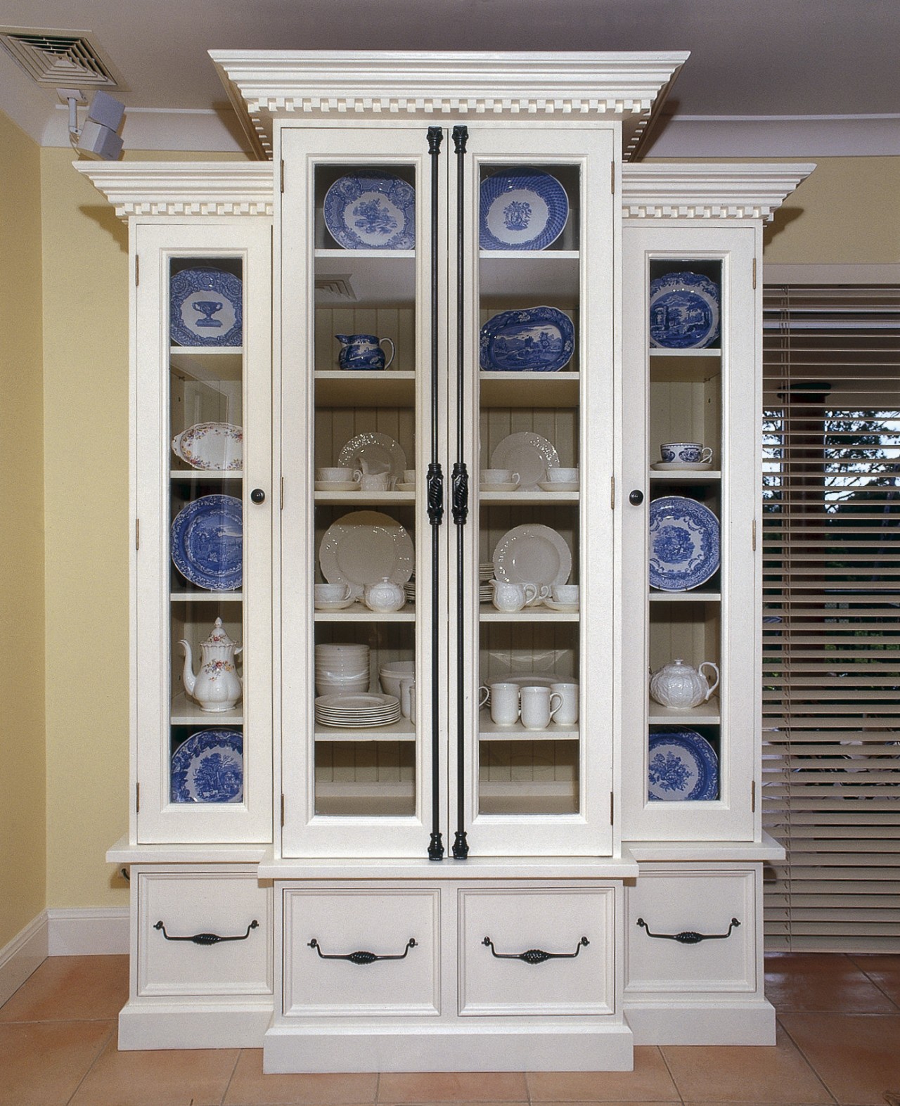 Detailed, real wood cabinetry provides an attractive decor bookcase, cabinetry, cupboard, display case, furniture, shelf, shelving, gray