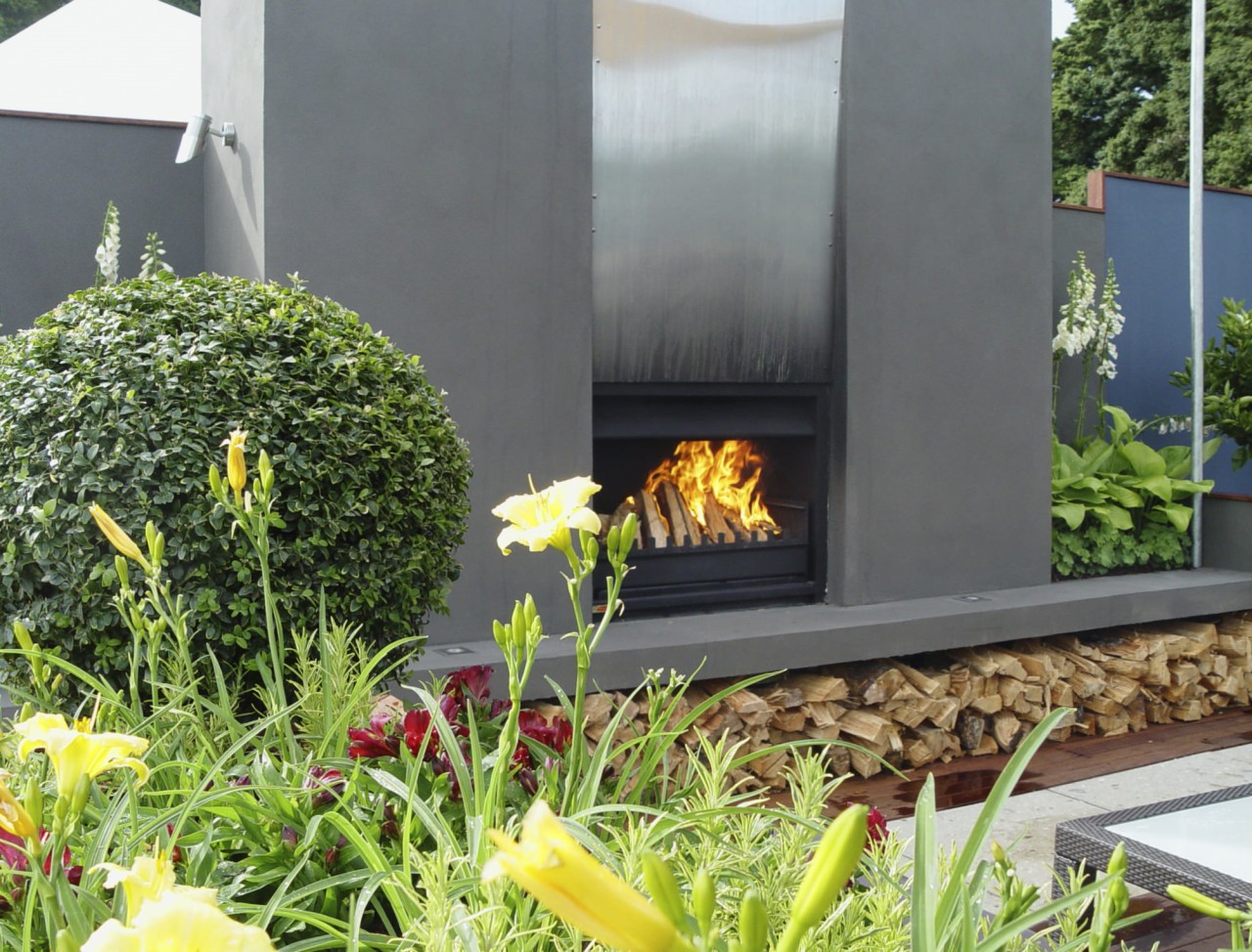 View of an outdoor fireplace supplied by The garden, grass, landscape, landscaping, plant, yard, gray