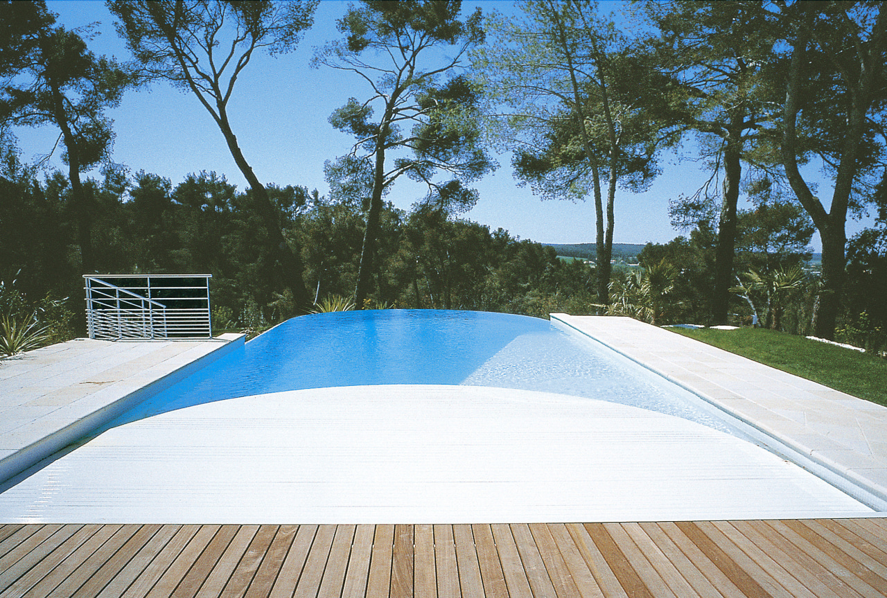 Image of a pool which features a pool architecture, backyard, daylighting, estate, house, leisure, outdoor structure, property, real estate, roof, shade, sky, sunlounger, swimming pool, wood, white, teal