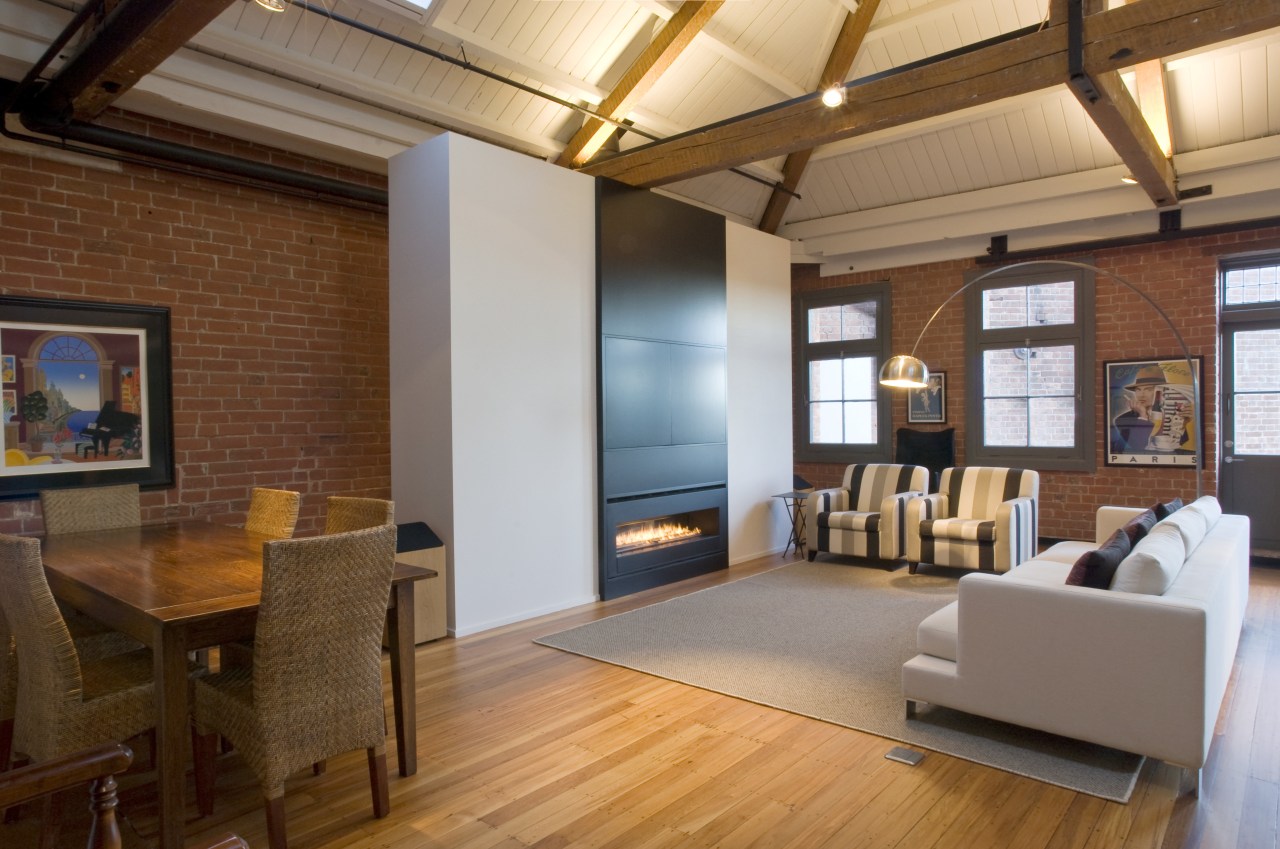 View of the main living area, which has ceiling, flooring, hardwood, interior design, living room, loft, real estate, room, wood flooring, brown