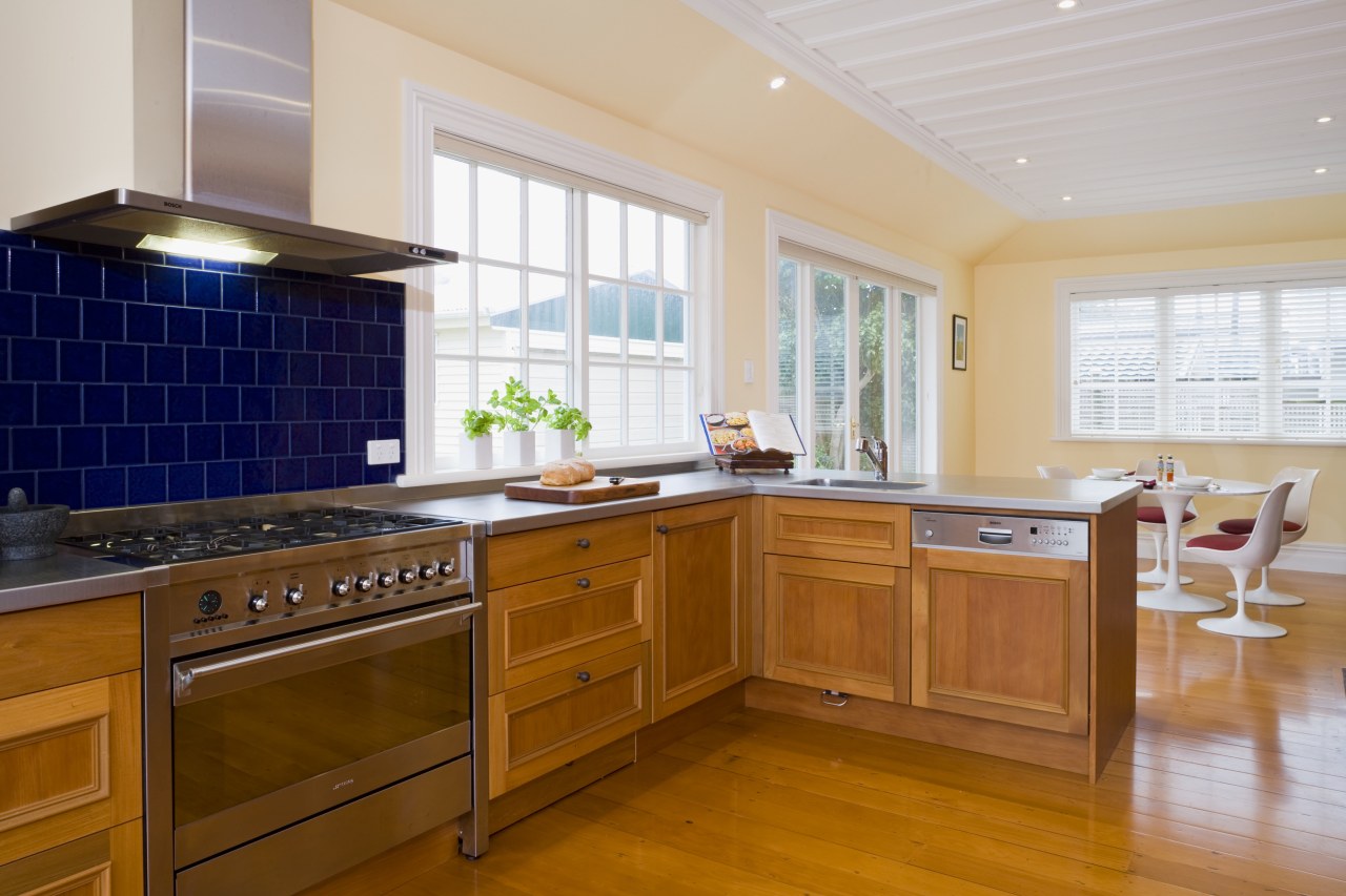 view of a renovated kitchen where Swamp kauri cabinetry, countertop, cuisine classique, floor, flooring, hardwood, home, interior design, kitchen, property, real estate, room, window, brown, gray