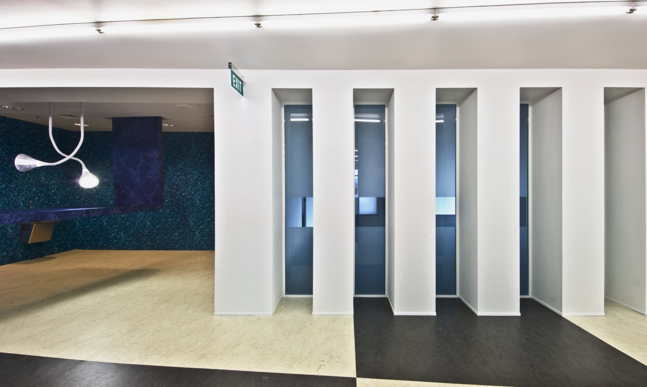 A reception desk covered in a thick pile exhibition, floor, flooring, interior design, structure, white