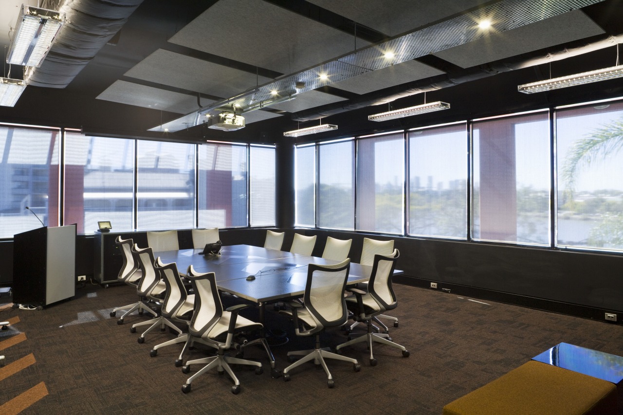 Extensive glazing floods the boardroom with natural light. conference hall, interior design, office, black