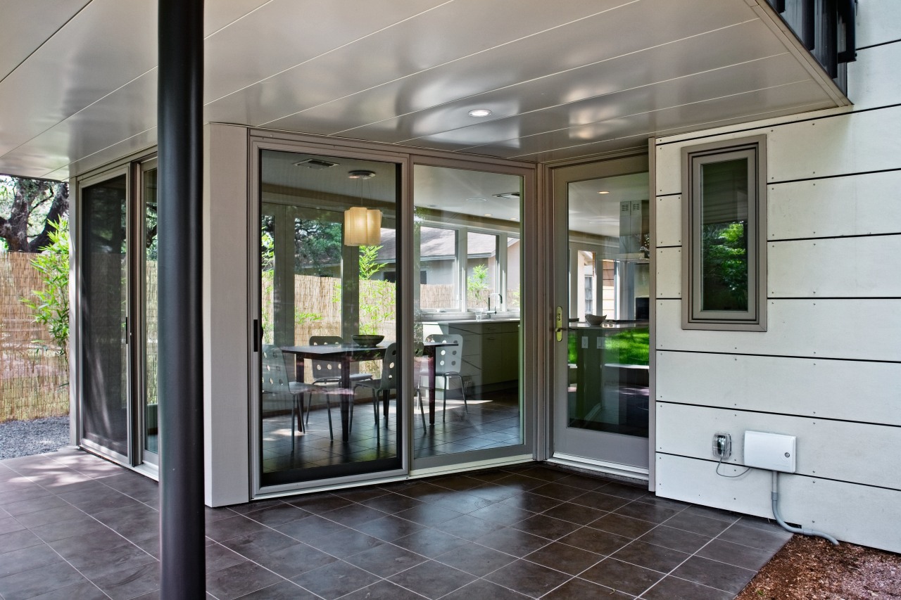 exterior view of the kitchen and dining area door, floor, glass, house, real estate, window, gray