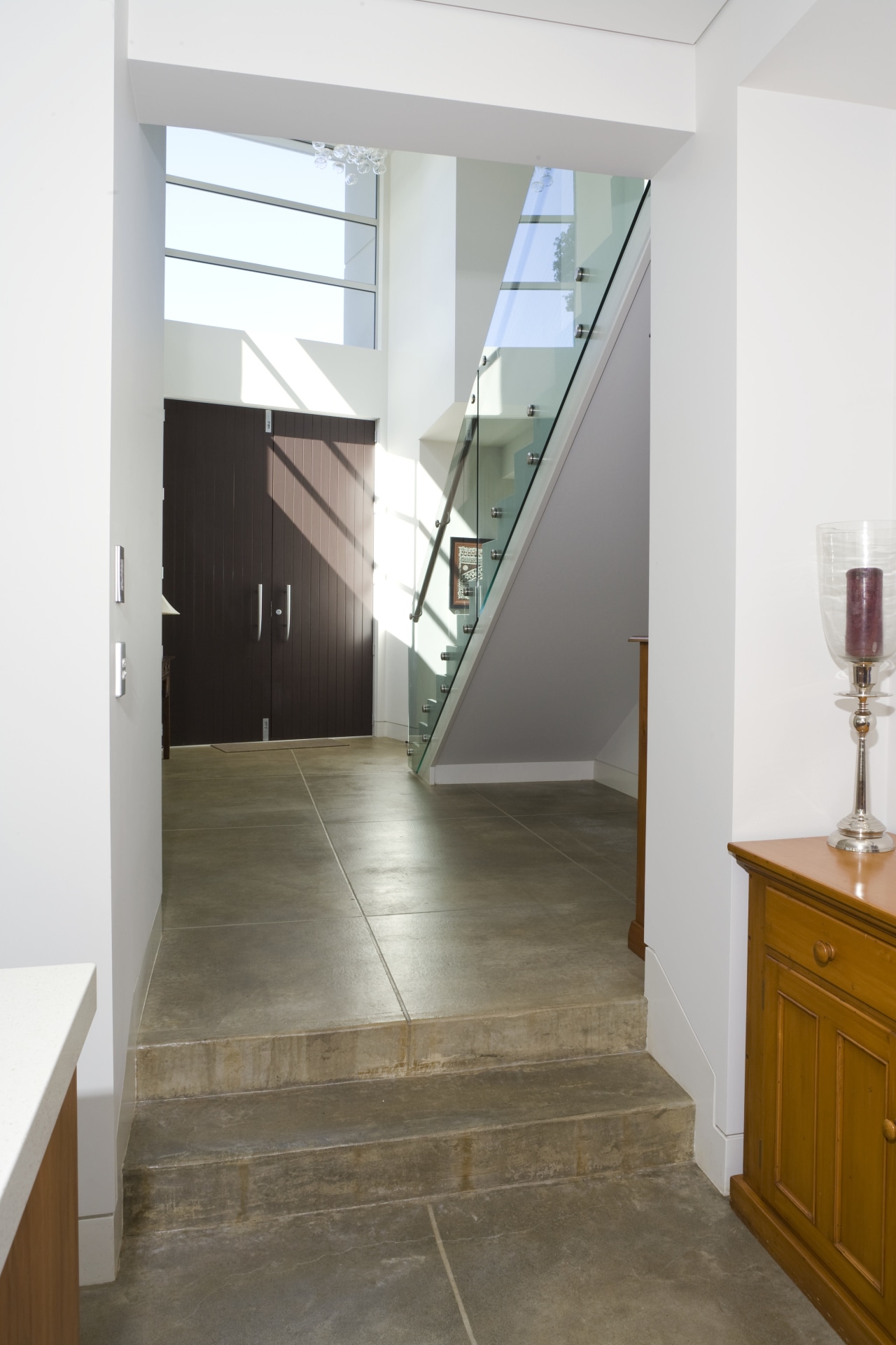 Coloured concrete from Peter Fell was used for apartment, architecture, daylighting, door, floor, flooring, glass, handrail, hardwood, home, house, interior design, laminate flooring, loft, property, real estate, stairs, wood, wood flooring, white
