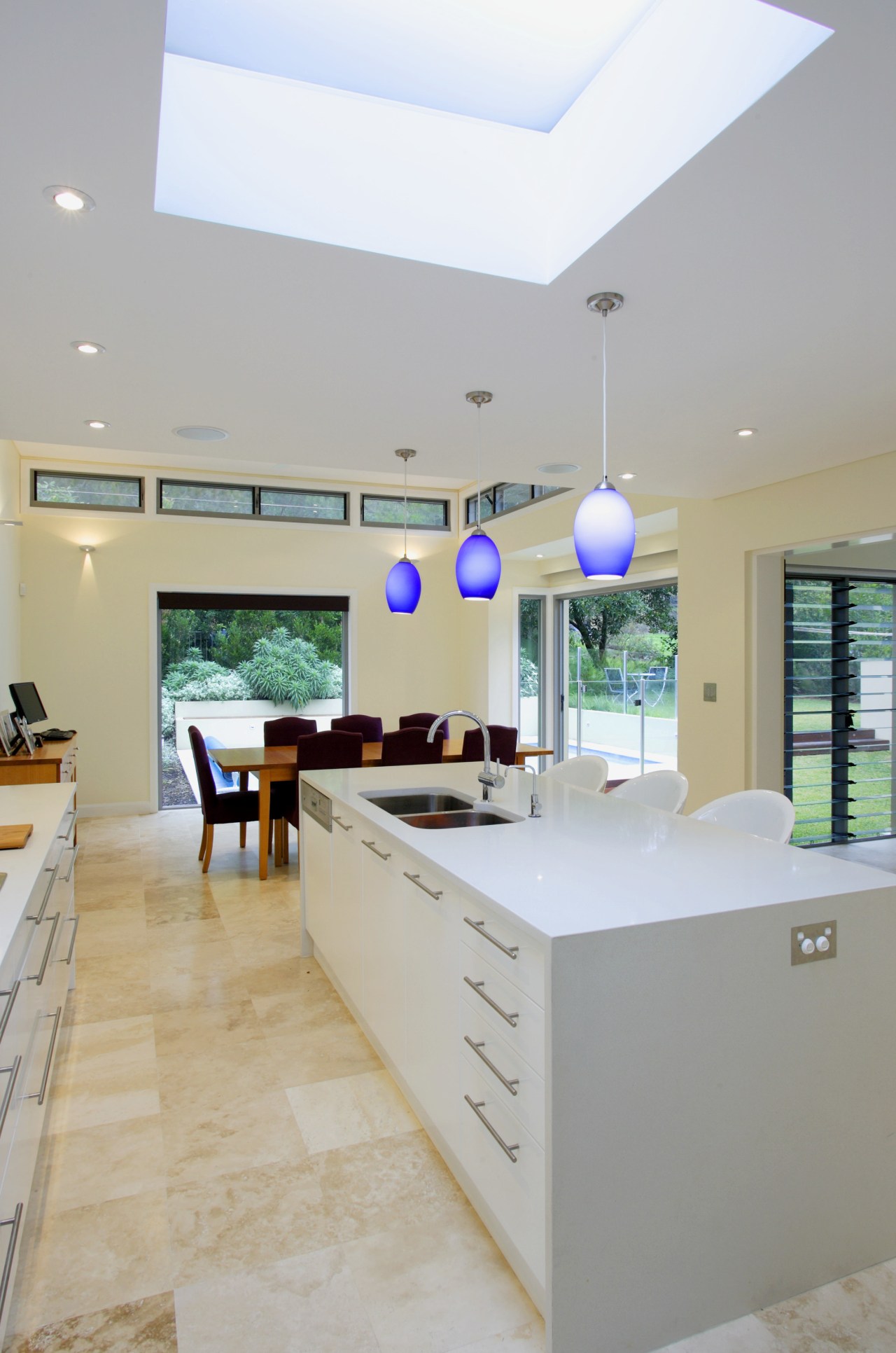 Large areas of glazing and skylight flood the ceiling, countertop, daylighting, estate, floor, home, house, interior design, kitchen, real estate, room, gray, white