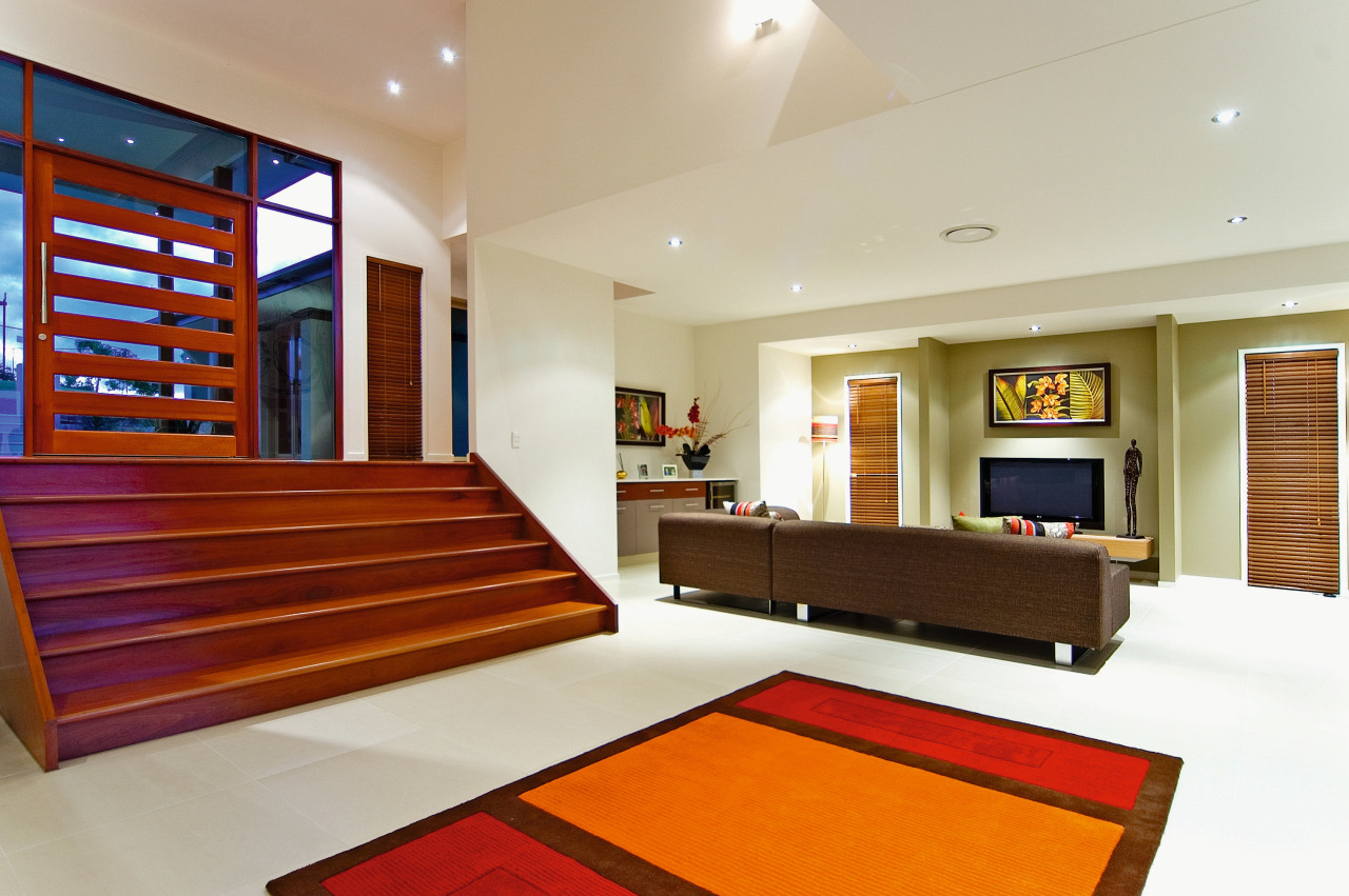 Wide timber stairs lead down into the formal ceiling, estate, floor, hardwood, home, interior design, living room, property, real estate, room, wood, gray