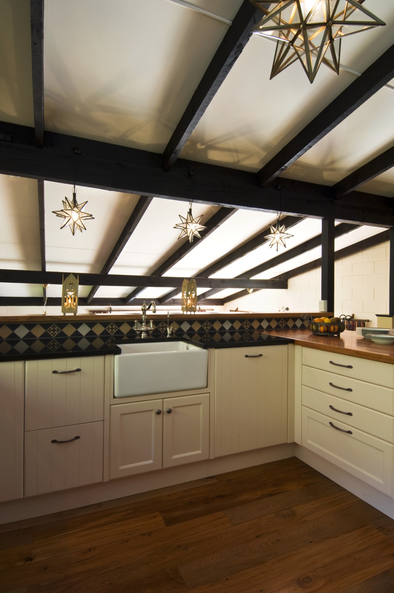 Image of kitchen designed by Debra DeLorenzo which cabinetry, ceiling, countertop, cuisine classique, daylighting, floor, interior design, kitchen, room, under cabinet lighting, wood, brown