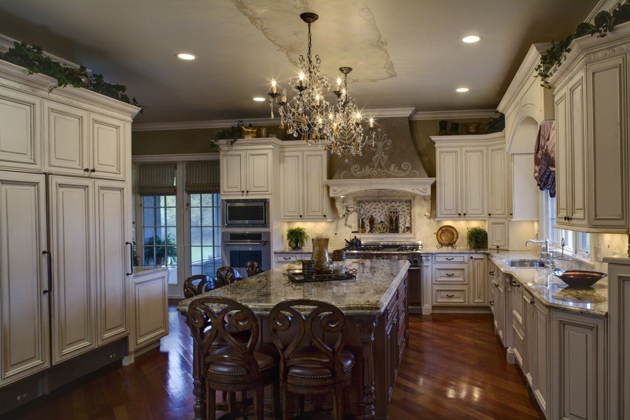 View of a kitchen which is centrally located cabinetry, ceiling, countertop, cuisine classique, dining room, home, interior design, kitchen, living room, room, brown