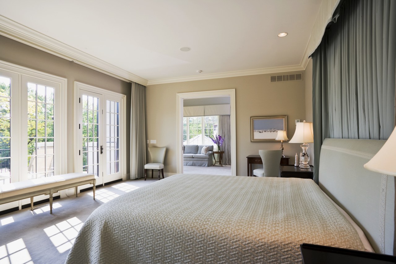 View of master bedroom which features bedroom furnishings, bedroom, ceiling, estate, floor, home, interior design, property, real estate, room, suite, window, gray