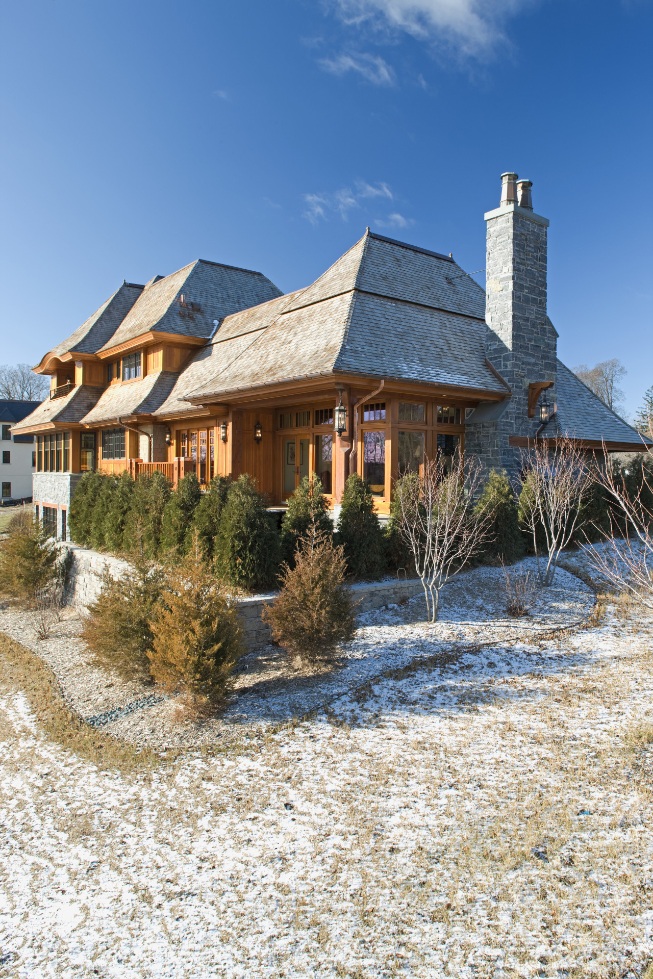 Exterior view of this home designed by Charlie building, cottage, estate, home, house, property, real estate, roof, sky, white