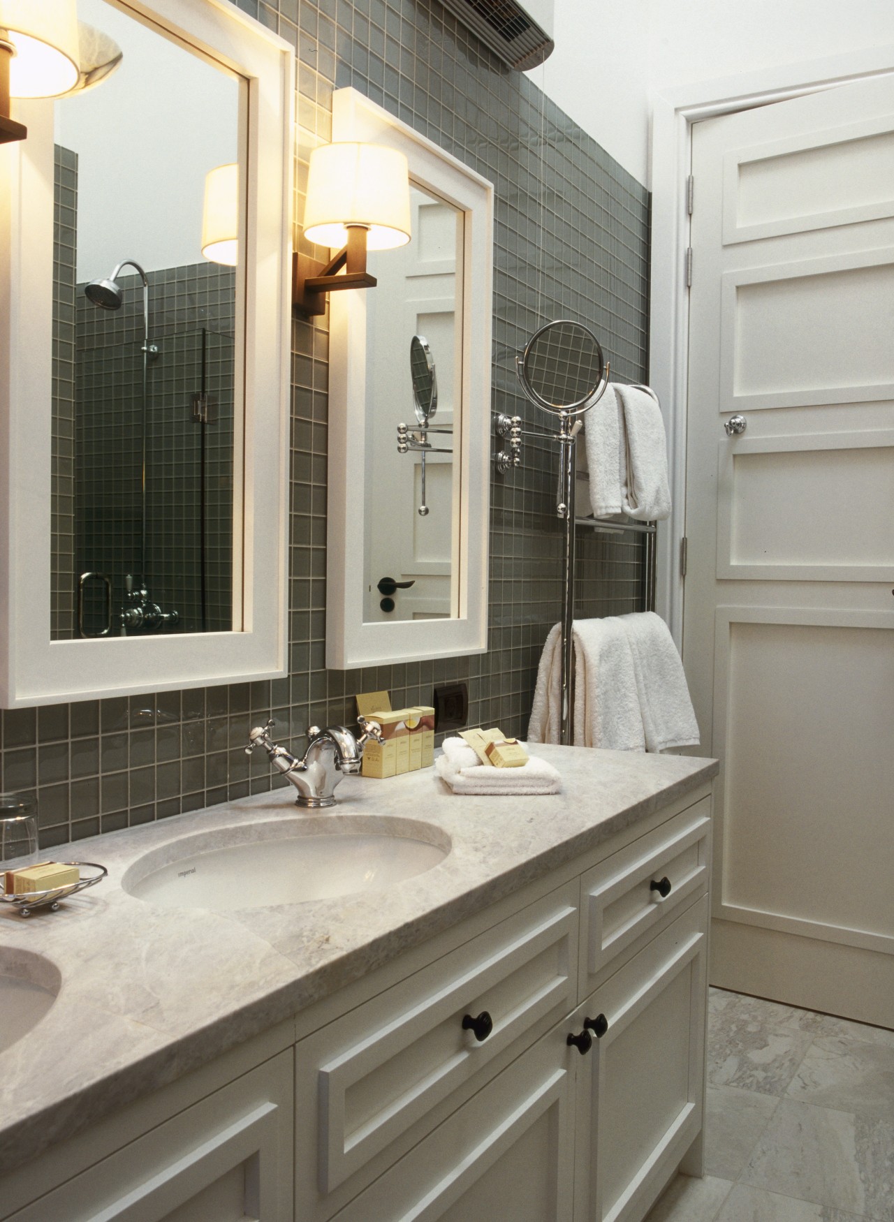 View of bathroom featuring vanity with twin basins, bathroom, bathroom accessory, bathroom cabinet, cabinetry, countertop, cuisine classique, floor, home, interior design, kitchen, room, sink, gray