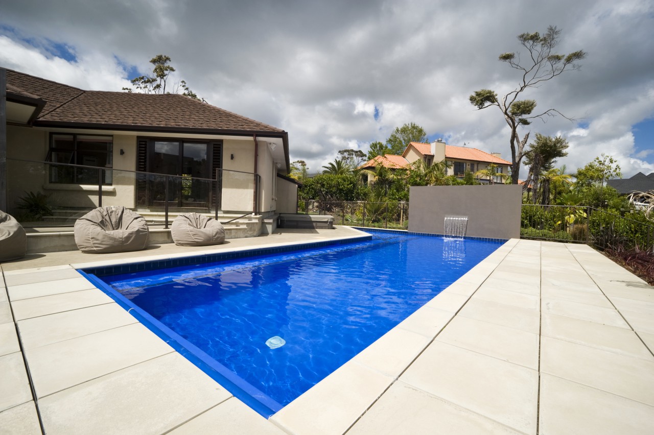 Exterior view of house which features a pool backyard, estate, home, house, leisure, property, real estate, residential area, resort, swimming pool, villa, white, gray