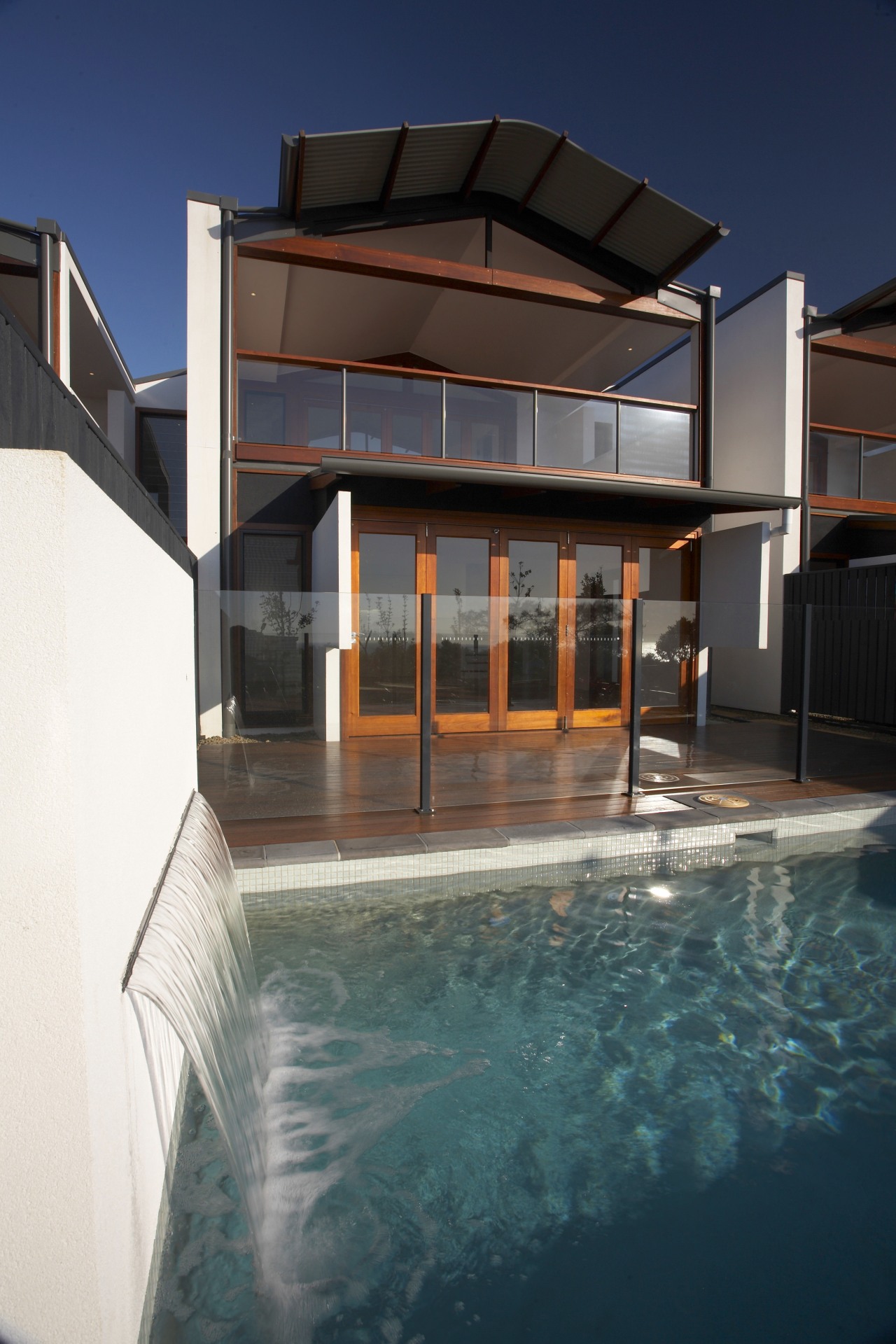 View of swimming pool by Ballina Pool Shop apartment, architecture, building, daylighting, estate, facade, home, house, property, real estate, reflection, swimming pool, water, window
