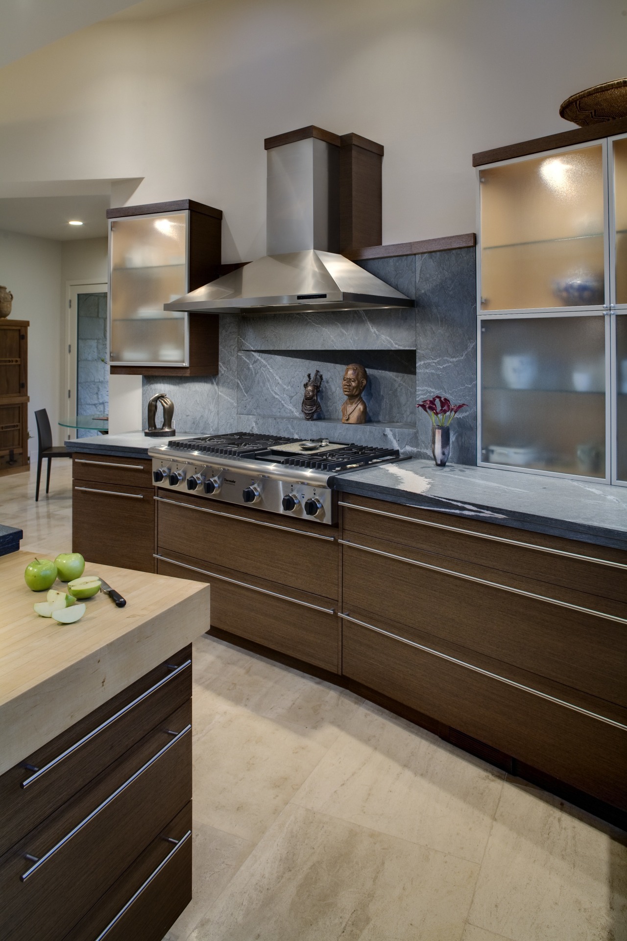 View of kitchen featuring kitchen island with 4 cabinetry, countertop, cuisine classique, floor, flooring, home appliance, interior design, kitchen, room, gray, brown