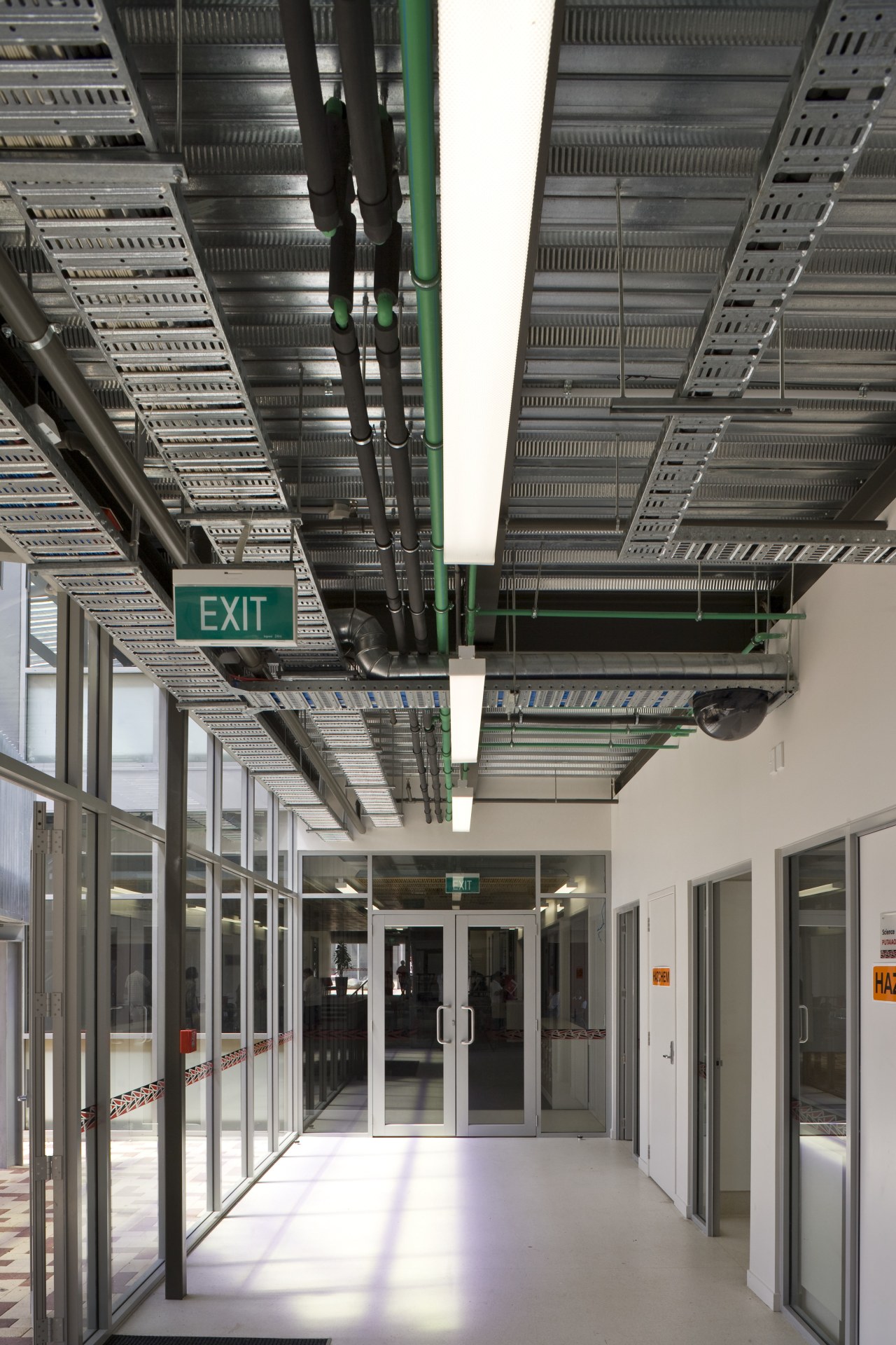 View of a hallway in the school which architecture, building, daylighting, glass, metropolitan area, gray, black