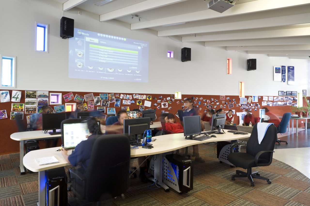 View of a working station with IT equipment. classroom, conference hall, institution, office, gray