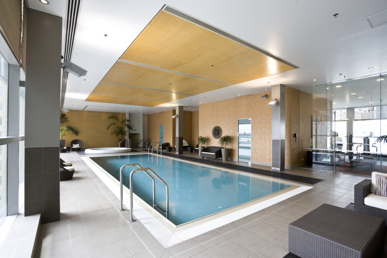 Image of pool and spa area in the apartment, condominium, estate, interior design, leisure, leisure centre, lobby, property, real estate, swimming pool, white, gray