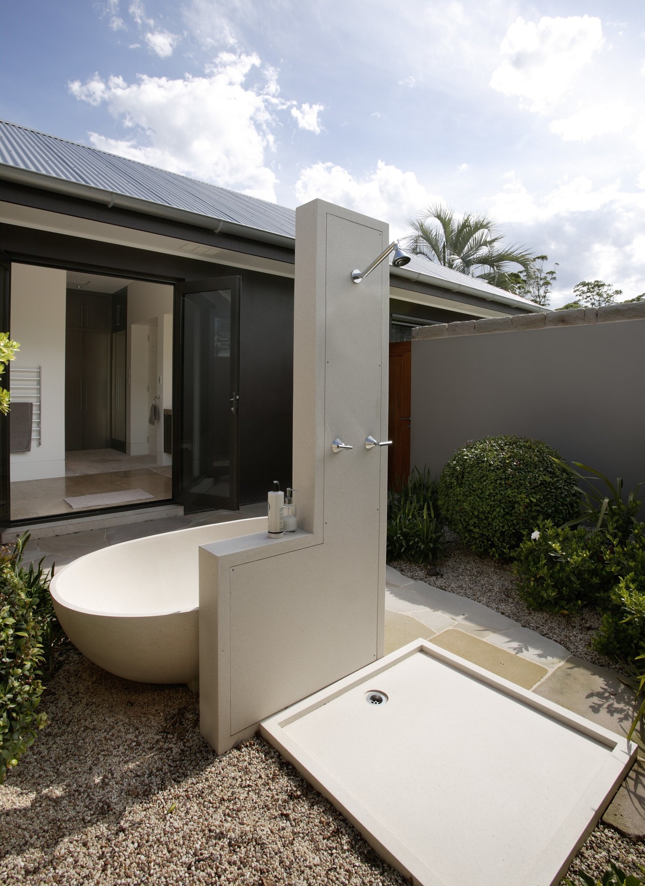 View of an outdoor freestanding bathtub and shower architecture, home, house, property, real estate, white
