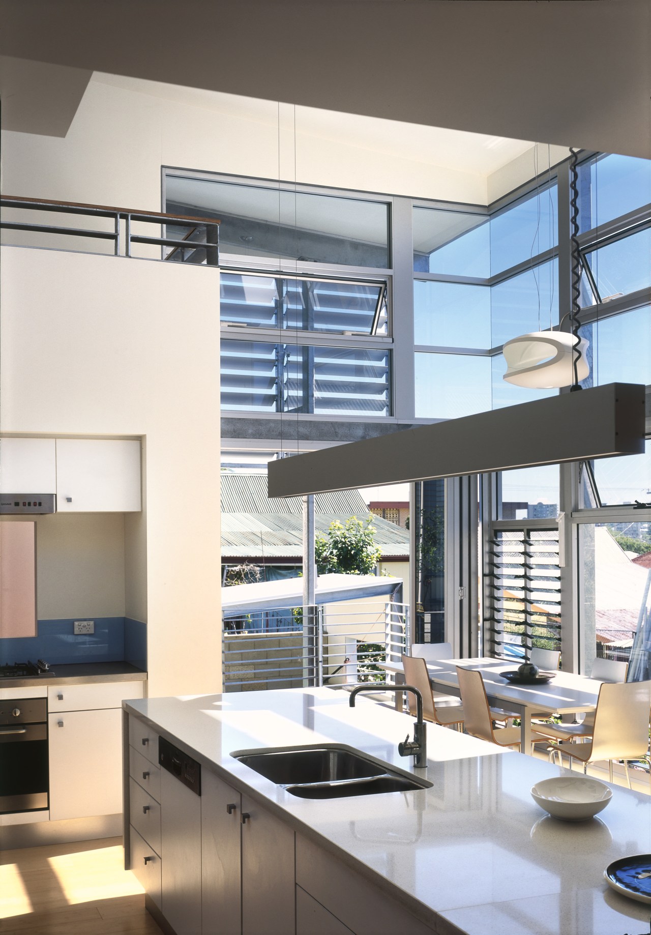 View of kitchen area a long kitchen island, countertop, daylighting, interior design, kitchen, window, white, gray