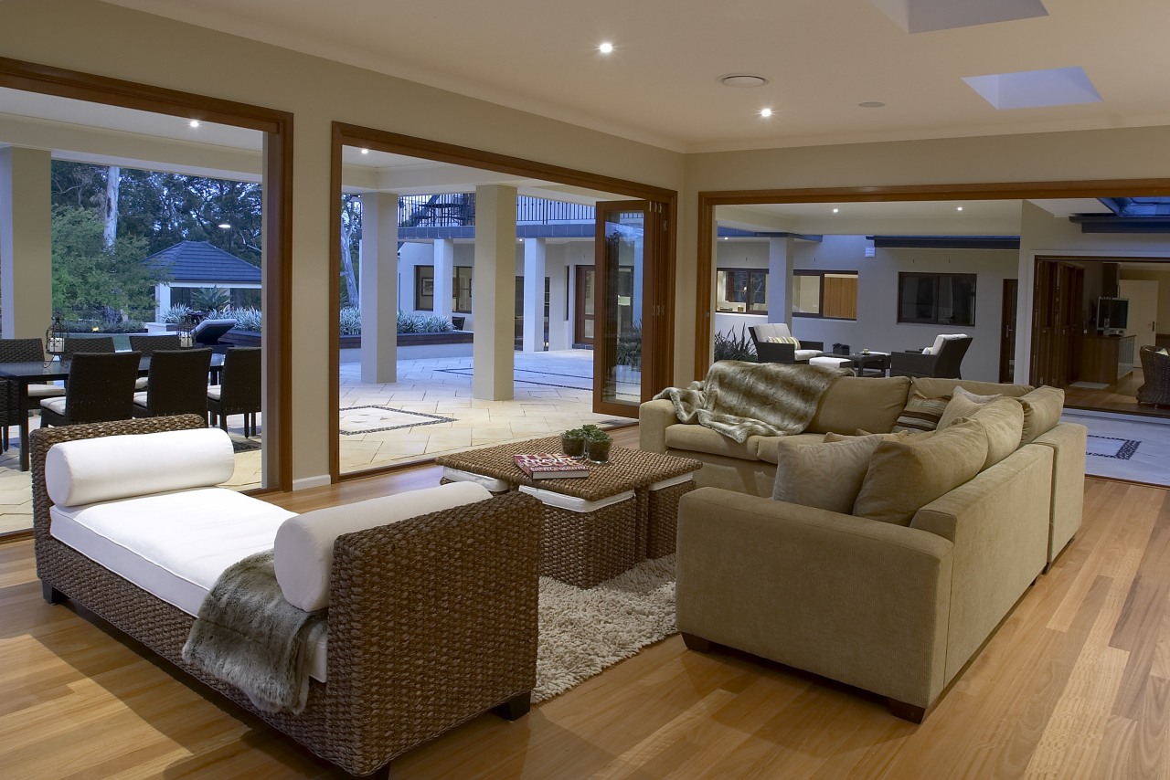 View of a living area of a home estate, floor, flooring, hardwood, home, interior design, living room, penthouse apartment, property, real estate, room, wall, window, wood, wood flooring, brown