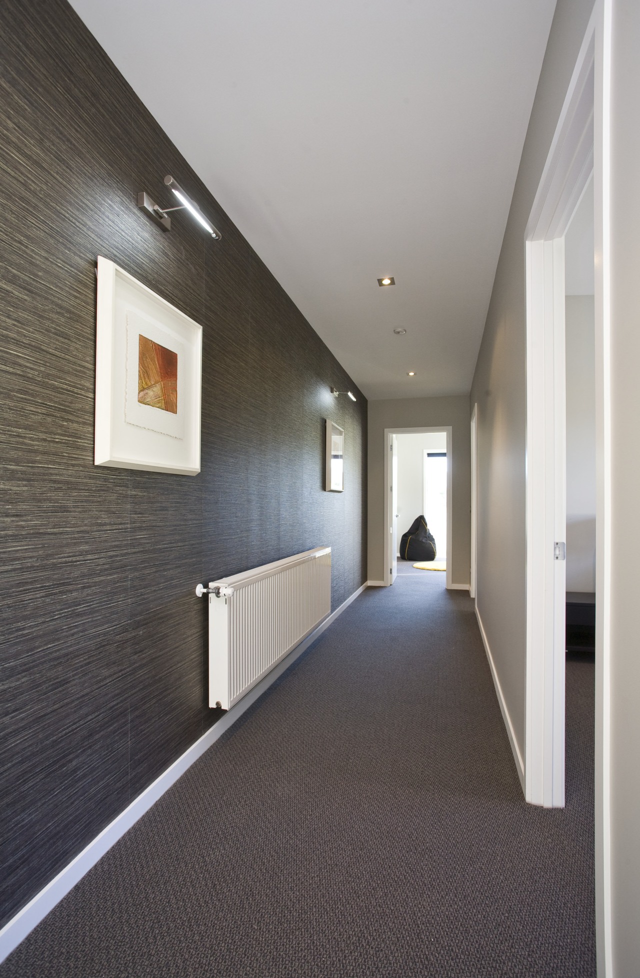 view of a passage way inside the home architecture, ceiling, daylighting, floor, flooring, interior design, lobby, real estate, wall, wood flooring, gray, black