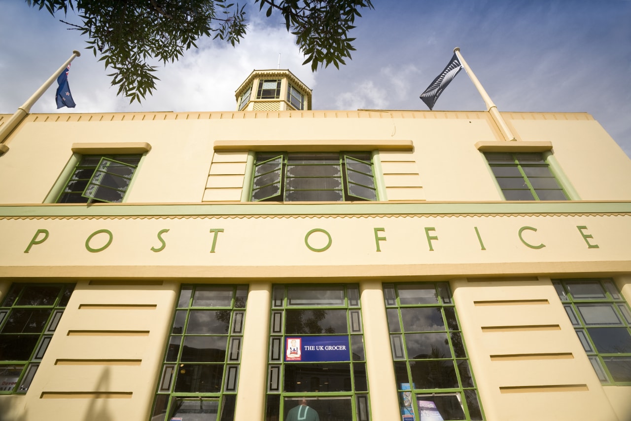 Exterior view of a restored post office building apartment, architecture, building, commercial building, condominium, daytime, elevation, estate, facade, home, hotel, house, property, real estate, residential area, window, orange