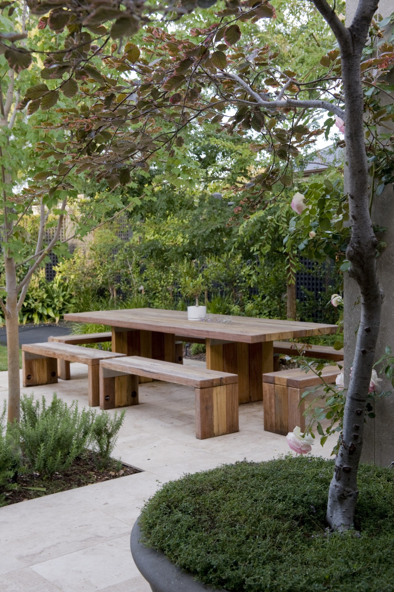 View of the outdoor area with outdoor dining backyard, courtyard, garden, landscaping, outdoor structure, plant, tree, walkway, wood, yard, brown, green, gray