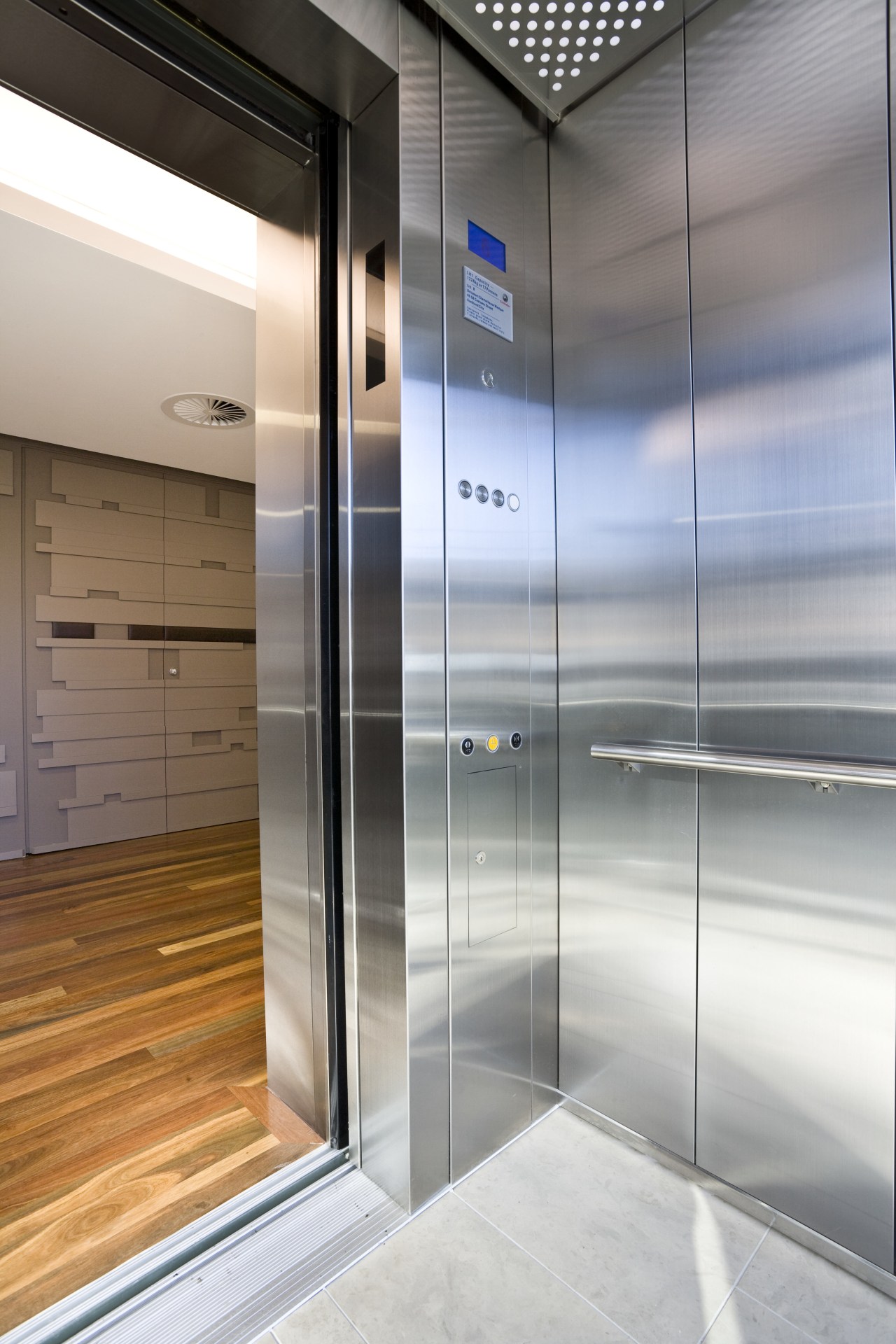 View of one of the lifts inside the elevator, gray