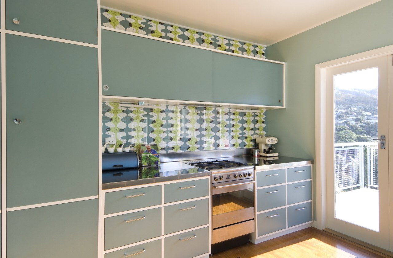 View of blue-painted kitchen cabinetry. cabinetry, countertop, home, interior design, kitchen, room, wall, window, gray