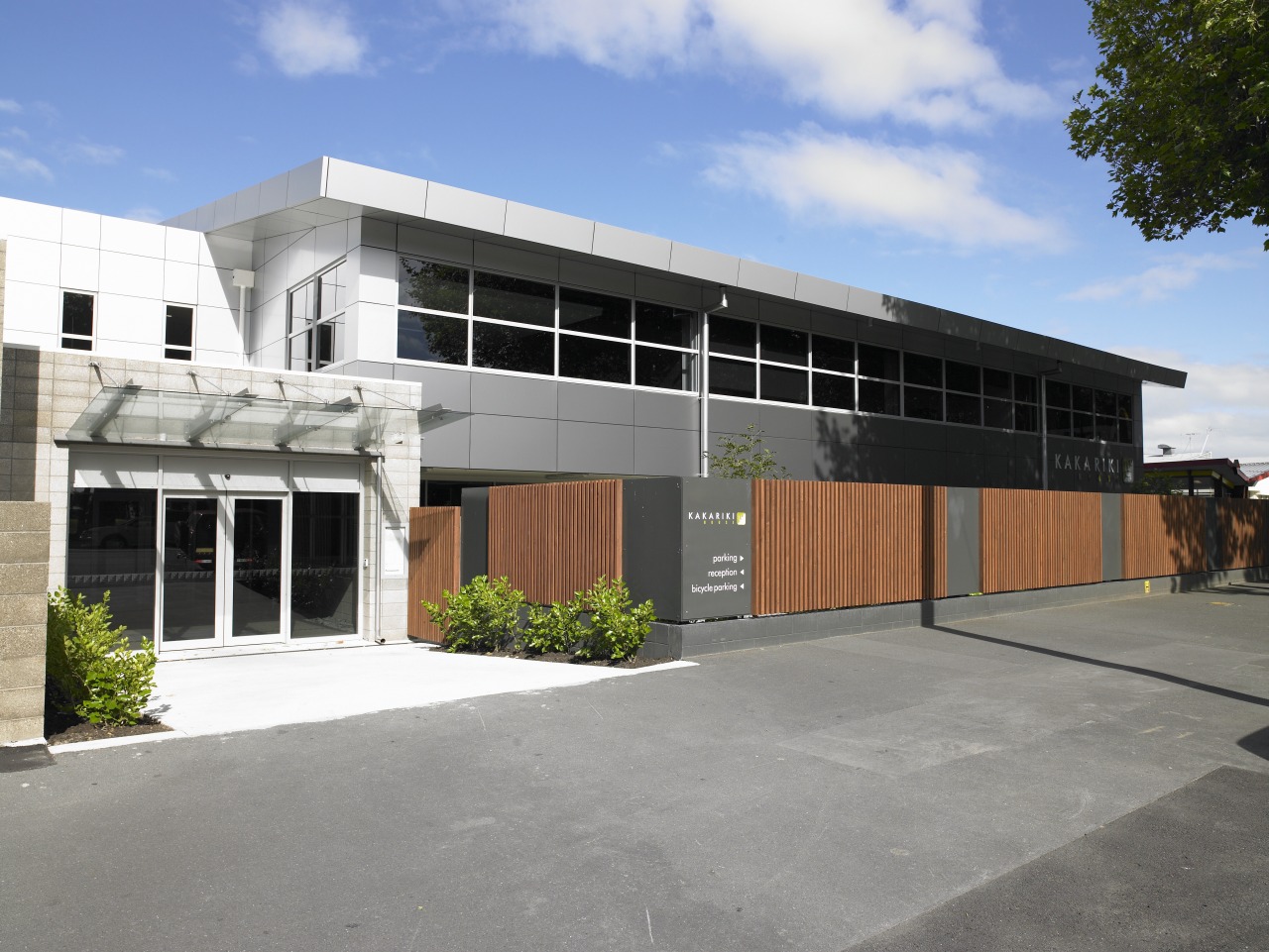 Exterior view of the redeveloped Kakariki House by architecture, building, commercial building, corporate headquarters, facade, property, real estate, residential area, gray