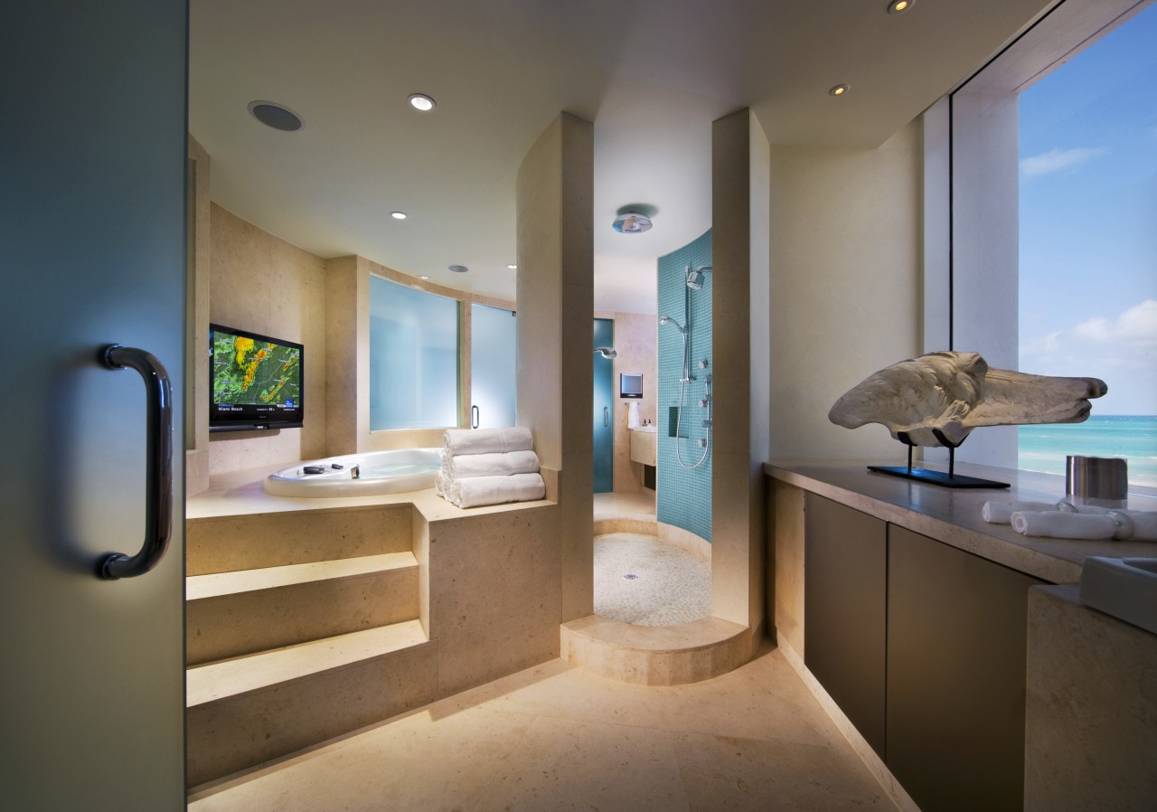 View of the master bathroom featuring a bathtub architecture, ceiling, home, interior design, real estate, room, suite, brown, gray