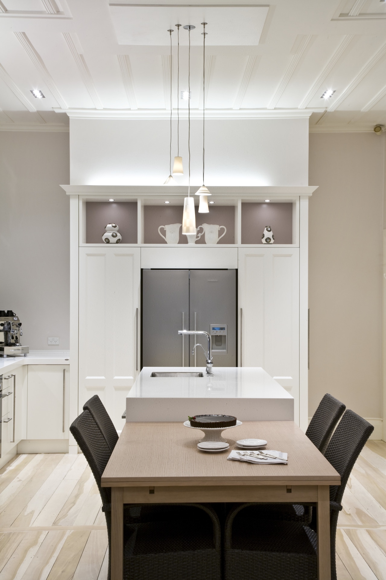 View of a renovated villa kitchen which features cabinetry, ceiling, floor, furniture, interior design, kitchen, living room, product design, room, table, gray