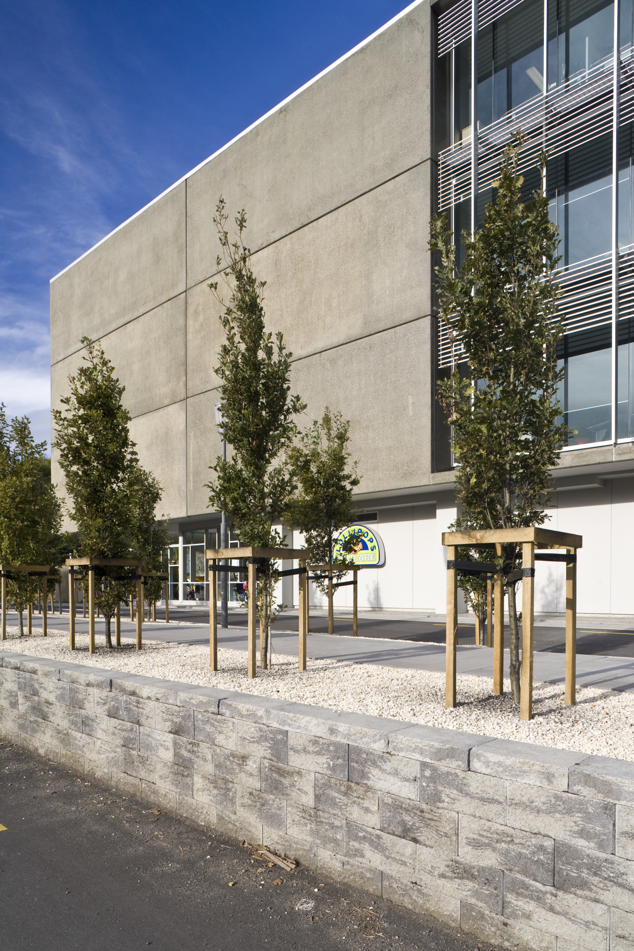 view of a planter box at Carlaw Park architecture, building, condominium, corporate headquarters, facade, headquarters, mixed use, neighbourhood, residential area, sky, structure, tree, urban design, gray