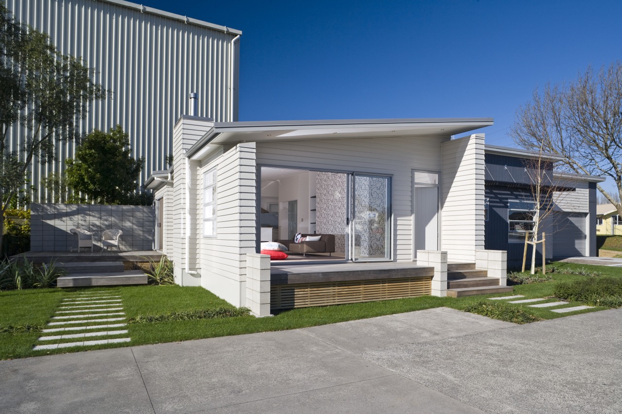 Exterior view of a Harmony Homes show home architecture, building, elevation, facade, home, house, luxury vehicle, property, real estate, residential area, siding, gray