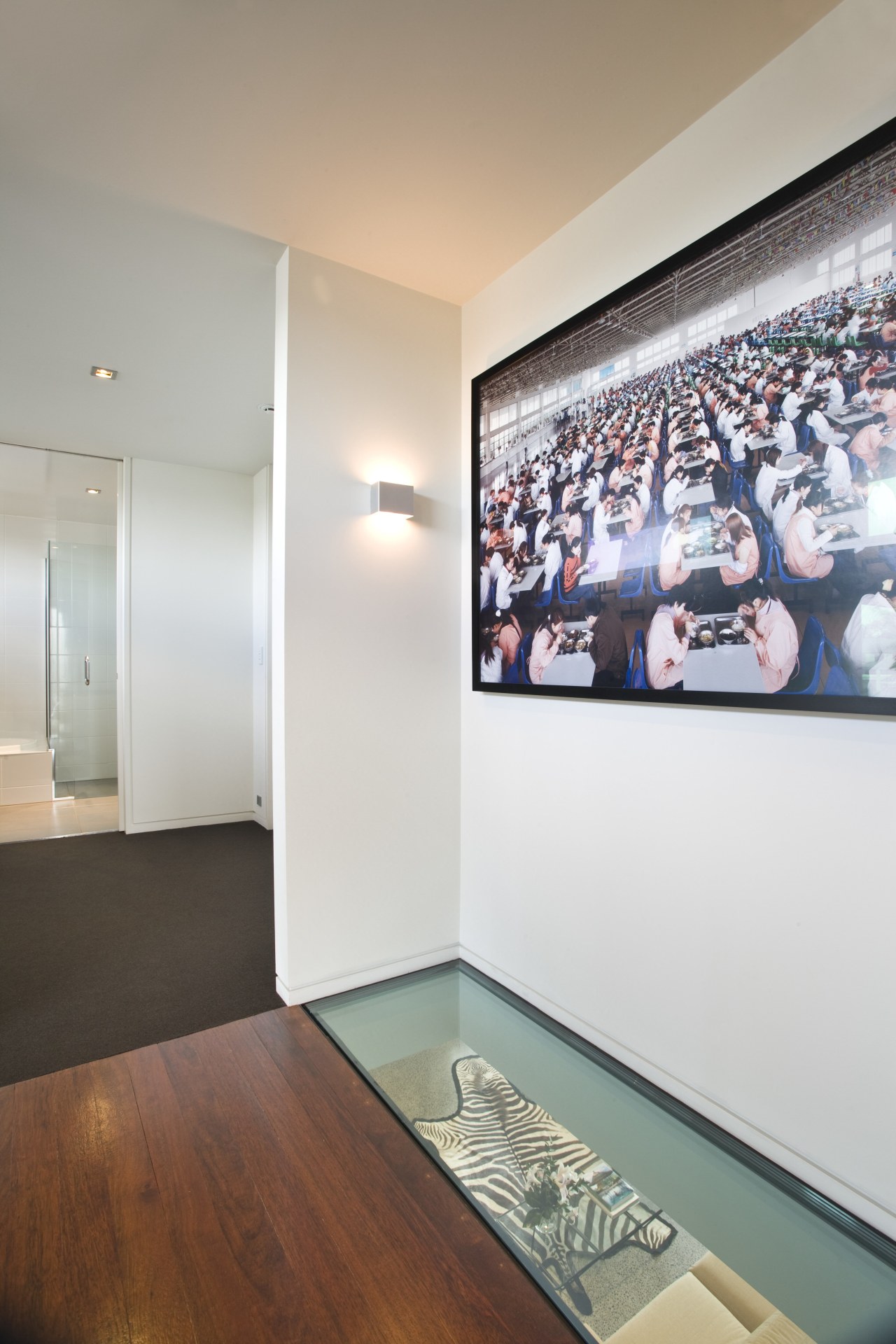 View of an upper level passageway which features ceiling, floor, interior design, room, wall, gray