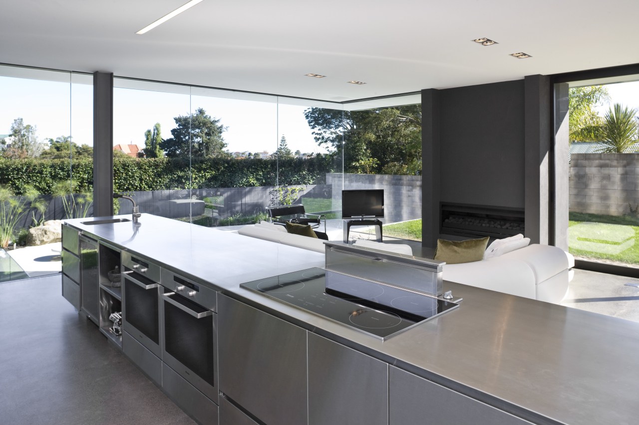 View of open-plan kitchen featuring polished concrete flooring, architecture, countertop, house, interior design, kitchen, real estate, gray, white