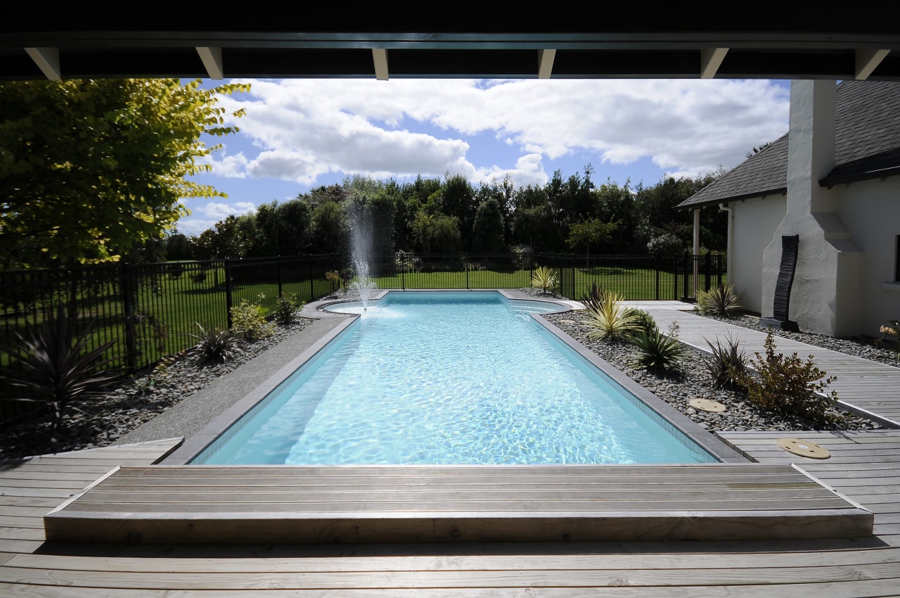 View of a pool are with a resort backyard, estate, home, house, leisure, property, real estate, reflection, sky, swimming pool, villa, water, water feature, black