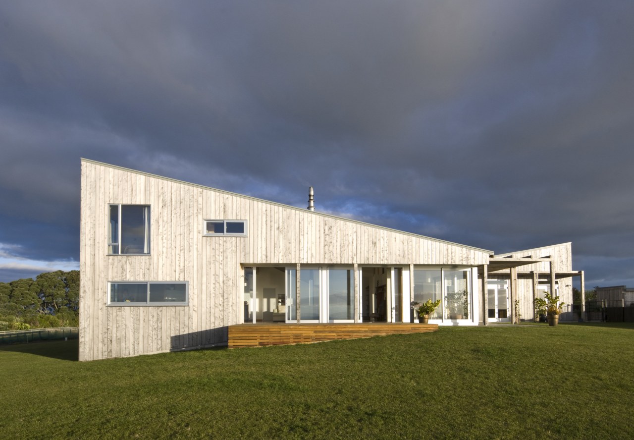 Exterior view of residence which features a monopitched architecture, cloud, corporate headquarters, cottage, elevation, facade, farmhouse, home, house, real estate, sky, gray, brown, blue