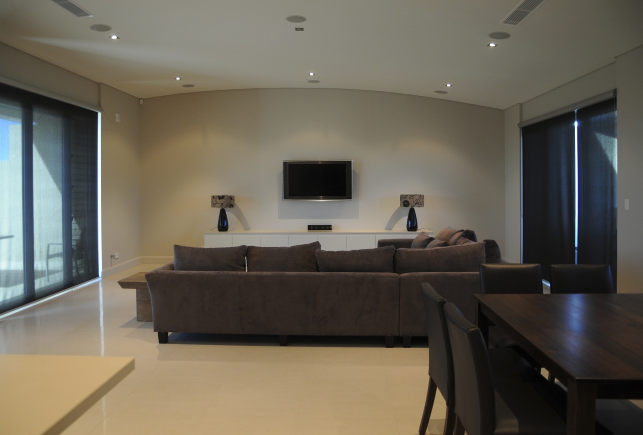 View of apartment living area at the Lindfield ceiling, floor, flooring, interior design, living room, property, real estate, room, table, wood flooring, black, gray