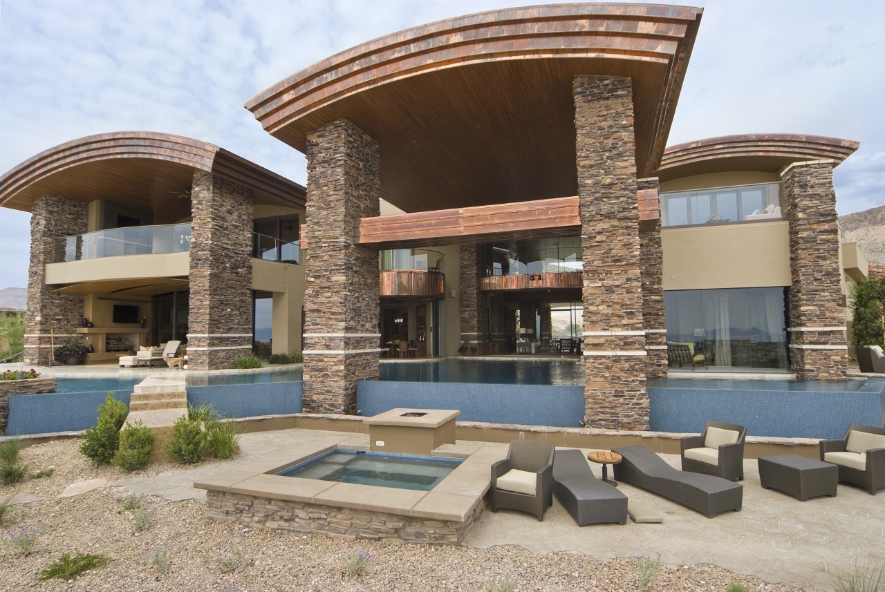 Exterior view of this home built by Sun architecture, estate, home, house, property, real estate, residential area, villa, brown, gray