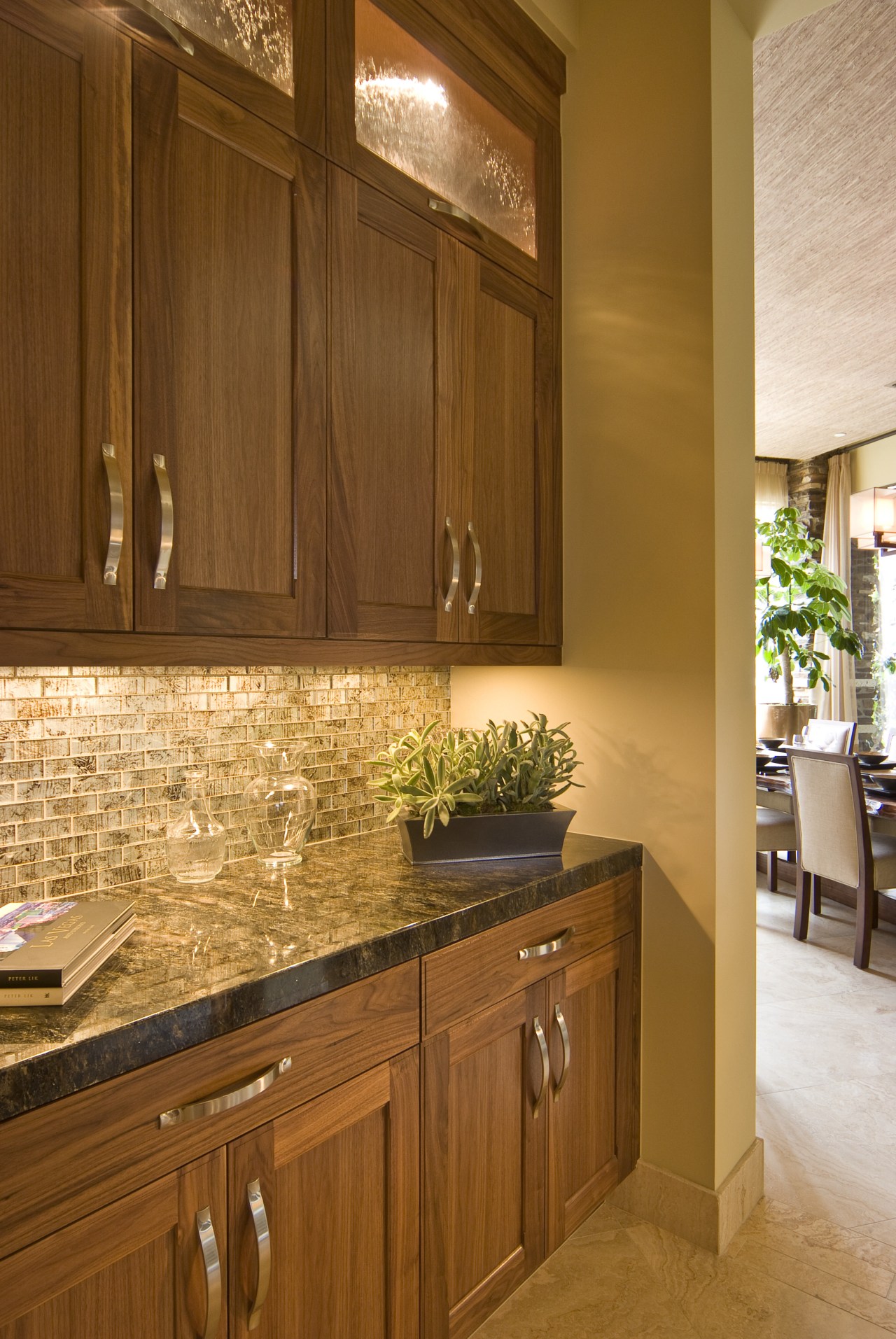 View of kitchen which features sold granite countertops cabinetry, countertop, cuisine classique, floor, flooring, hardwood, home, interior design, kitchen, room, under cabinet lighting, wood, wood flooring, wood stain, brown