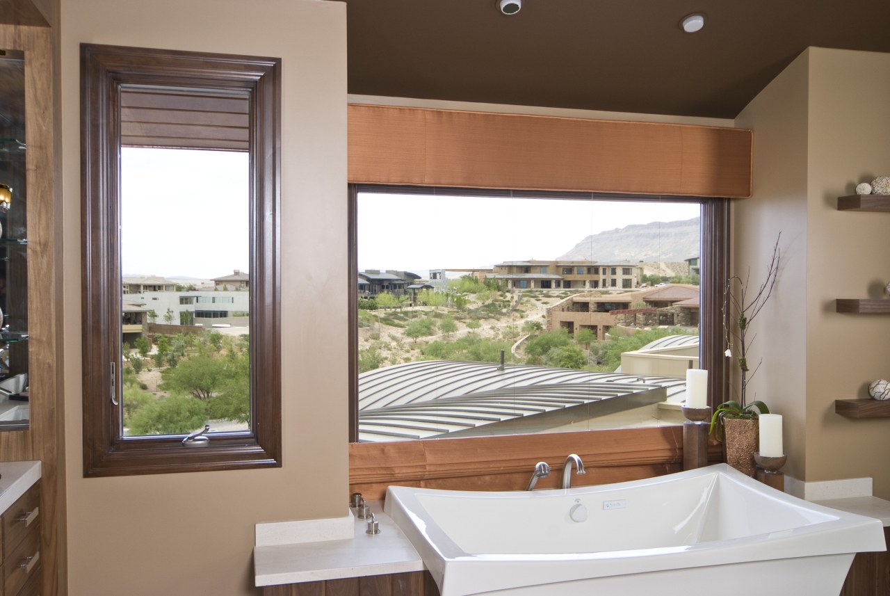 View of the bathroom which features exterior windows bathroom, daylighting, estate, home, interior design, real estate, room, window, brown, white