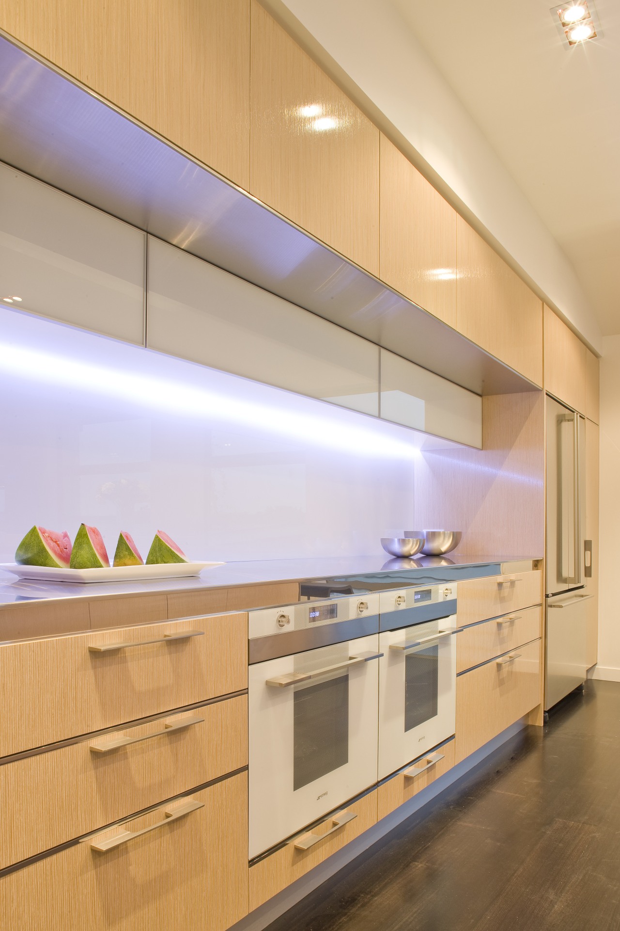 View of a kitchen designed by Mal Corbay architecture, cabinetry, ceiling, countertop, daylighting, interior design, kitchen, lighting, product design, under cabinet lighting, orange